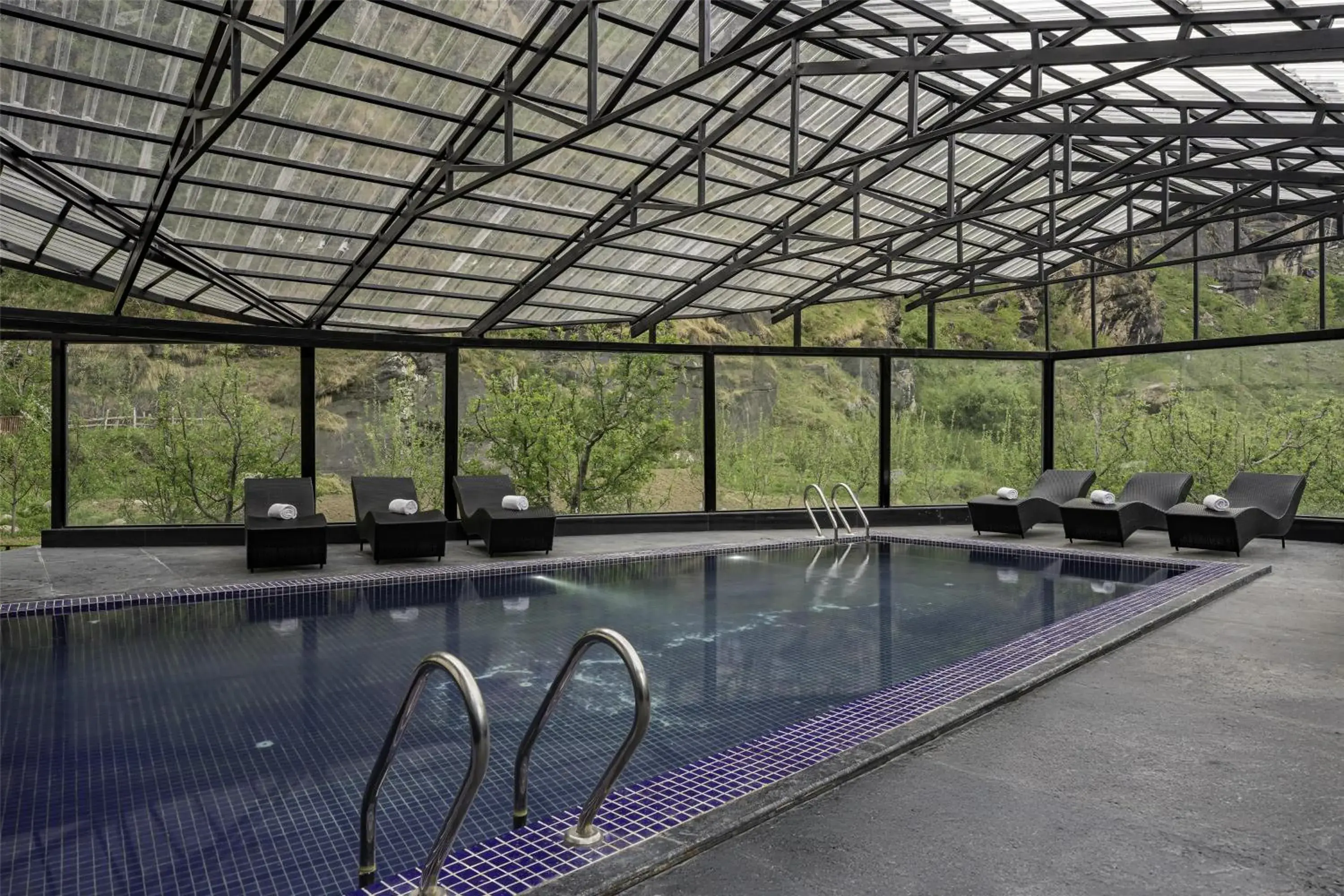 Pool view in Palchan Hotel & Spa - A member of Radisson Individuals Retreats Pool view in Palchan Hotel & Spa - A member of Radisson Individuals Retreats