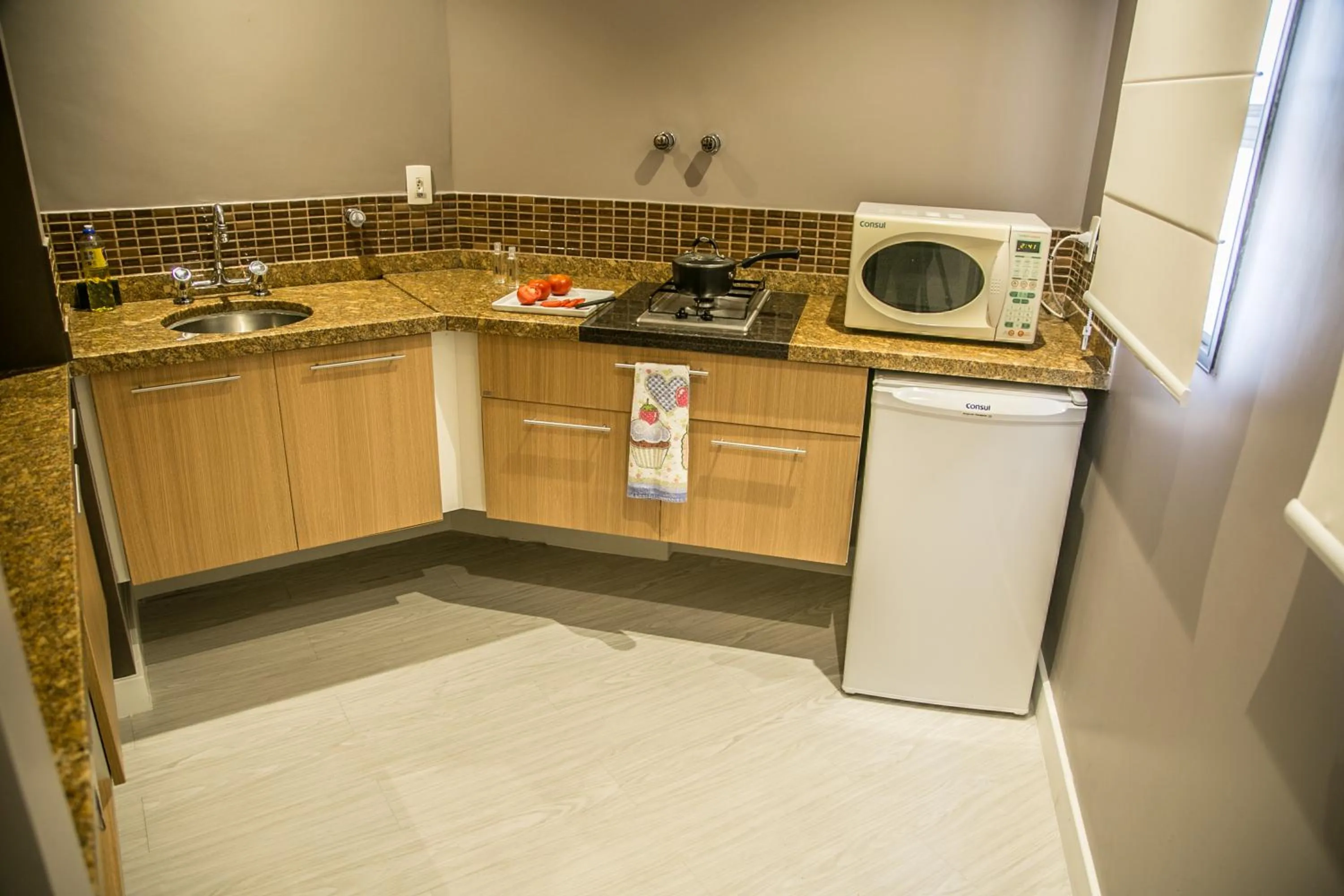 Kitchen or kitchenette in Cosmopolitan Praia Flat