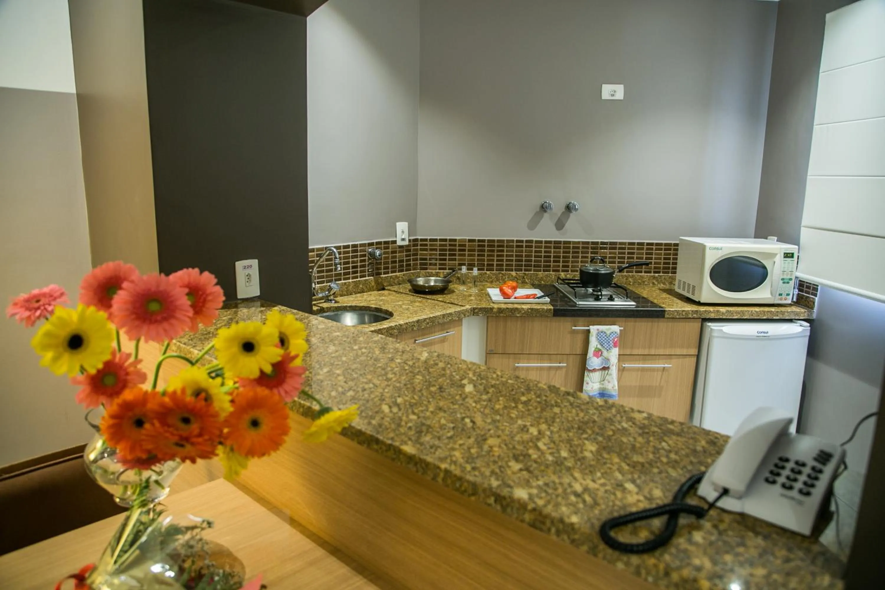 Kitchen or kitchenette in Cosmopolitan Praia Flat