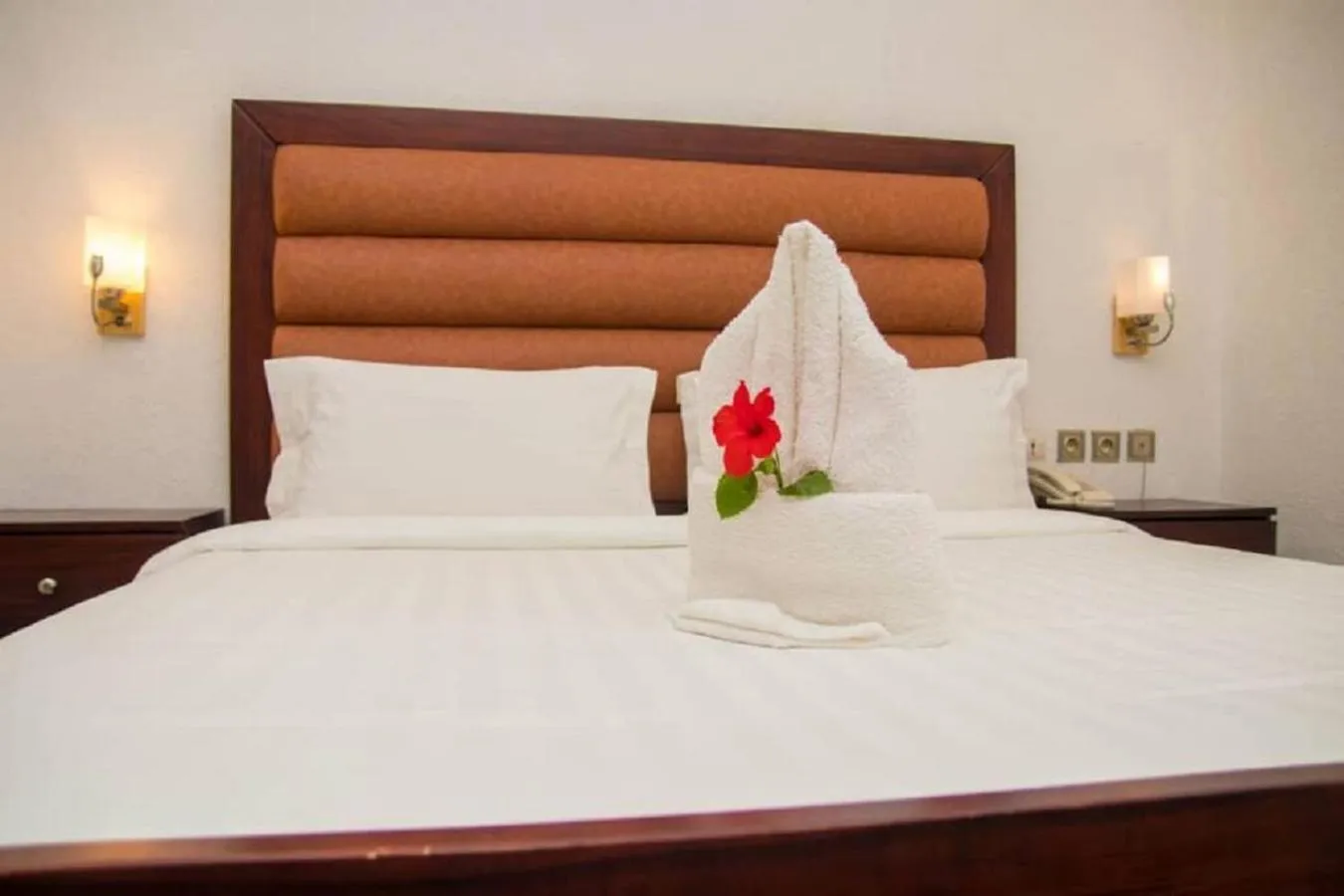 Bed in Hôtel Guest House Quatre Saisons