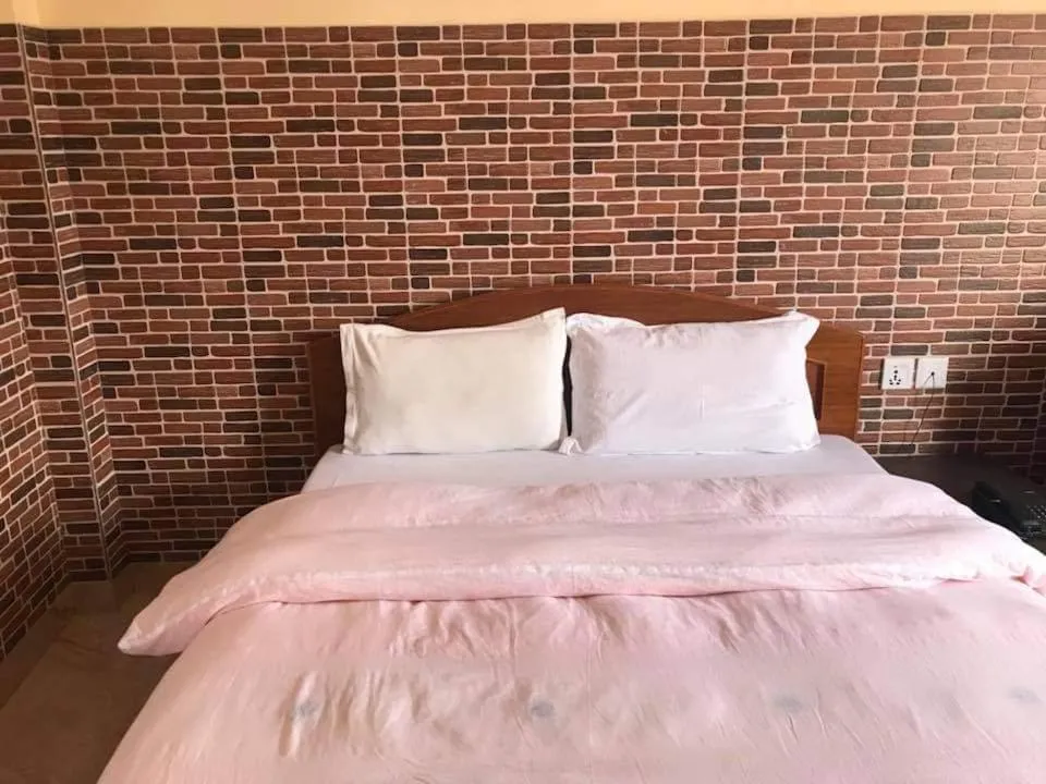 Bed in Hotel Center Inn Lake