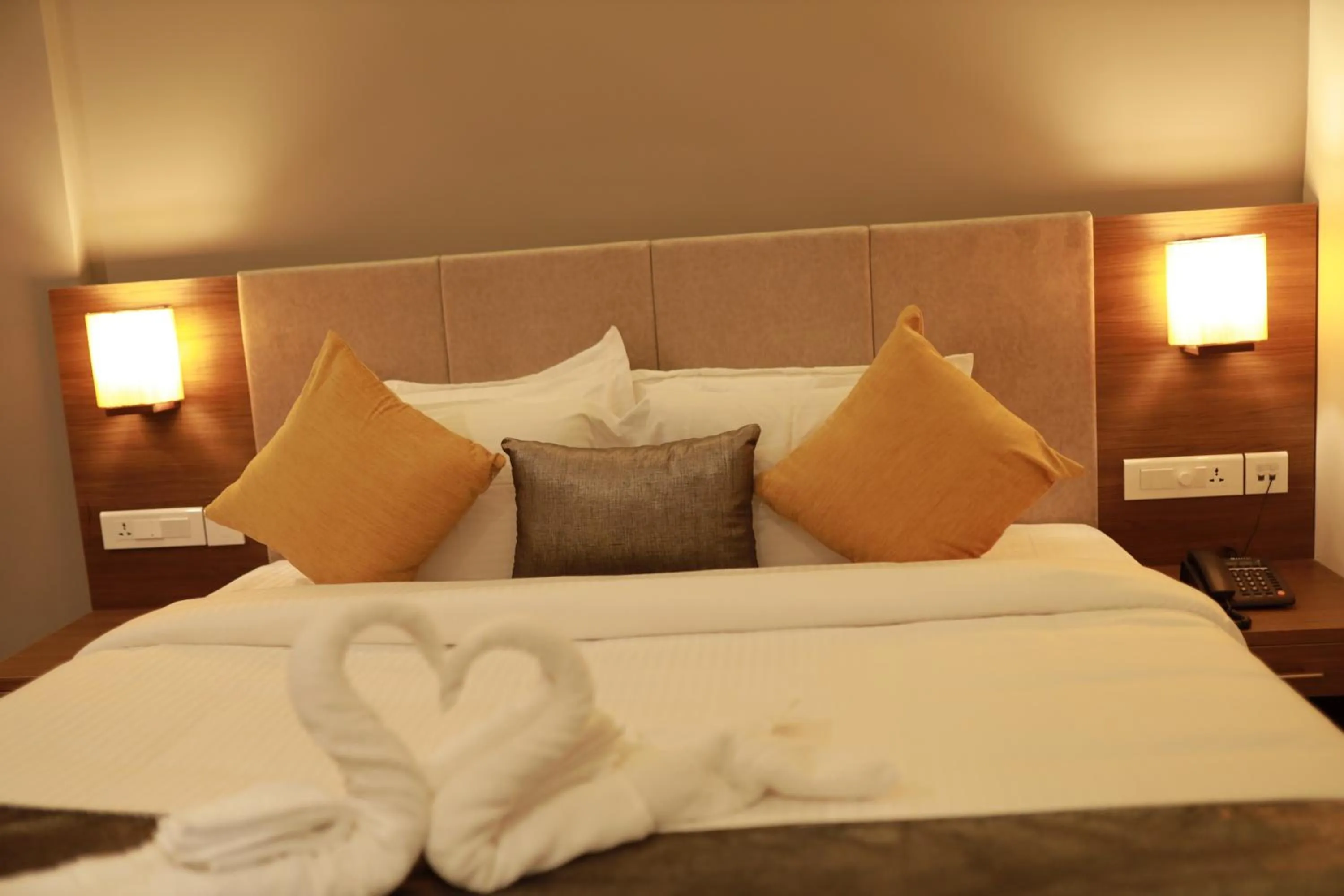 Bed in Hotel Kottayam Grand