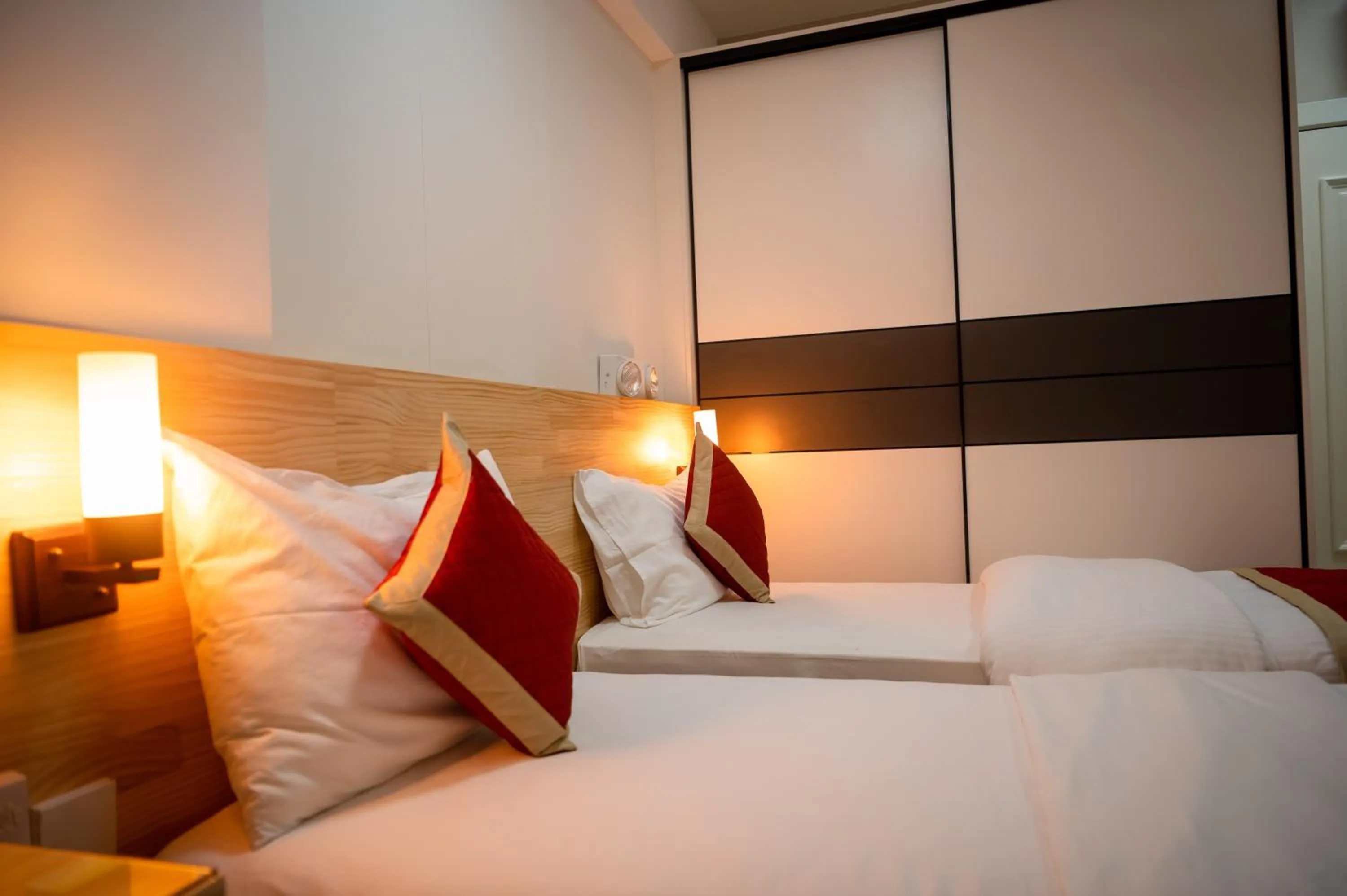 Bed in Tourist Inn Grand