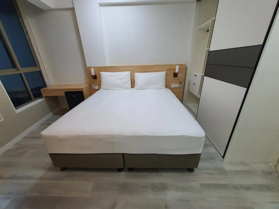 Bed in Tourist Inn Grand