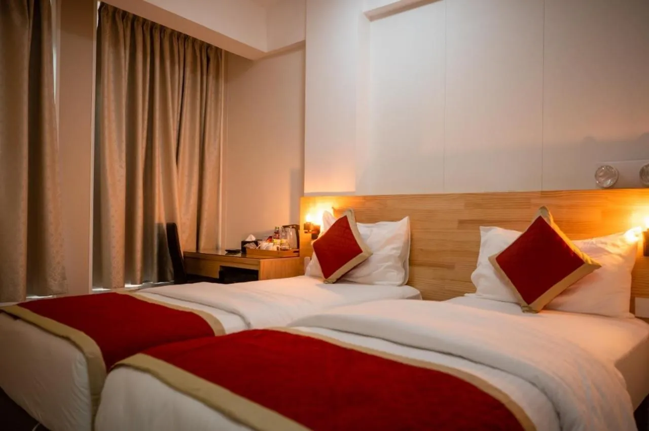 Bed in Tourist Inn Grand