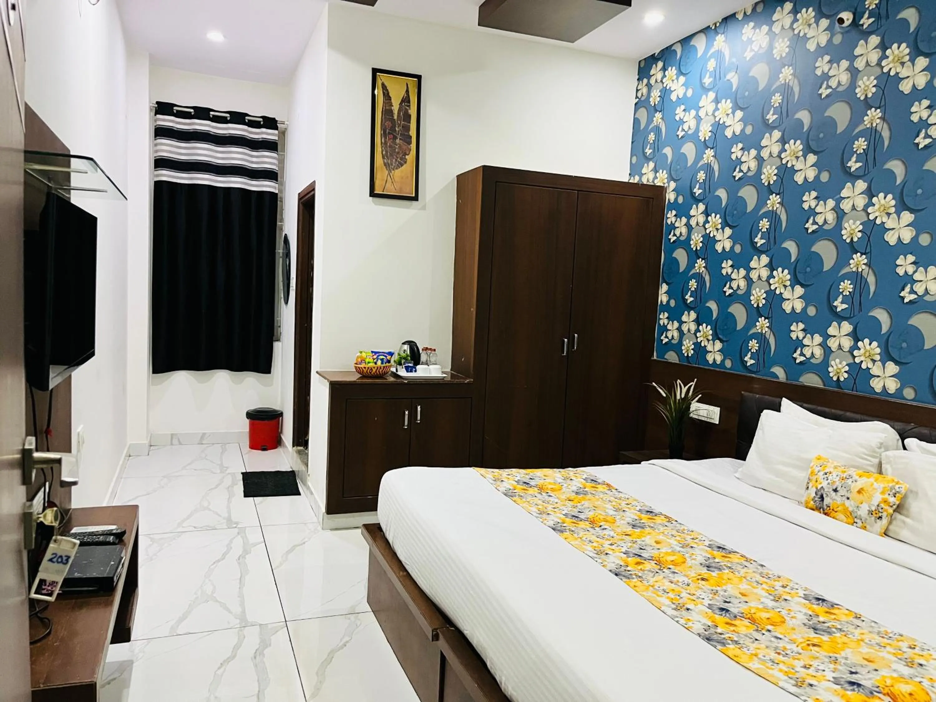 Communal lounge/ TV room, Bed in Hotel Plaza Hyderabad Airport Zone
