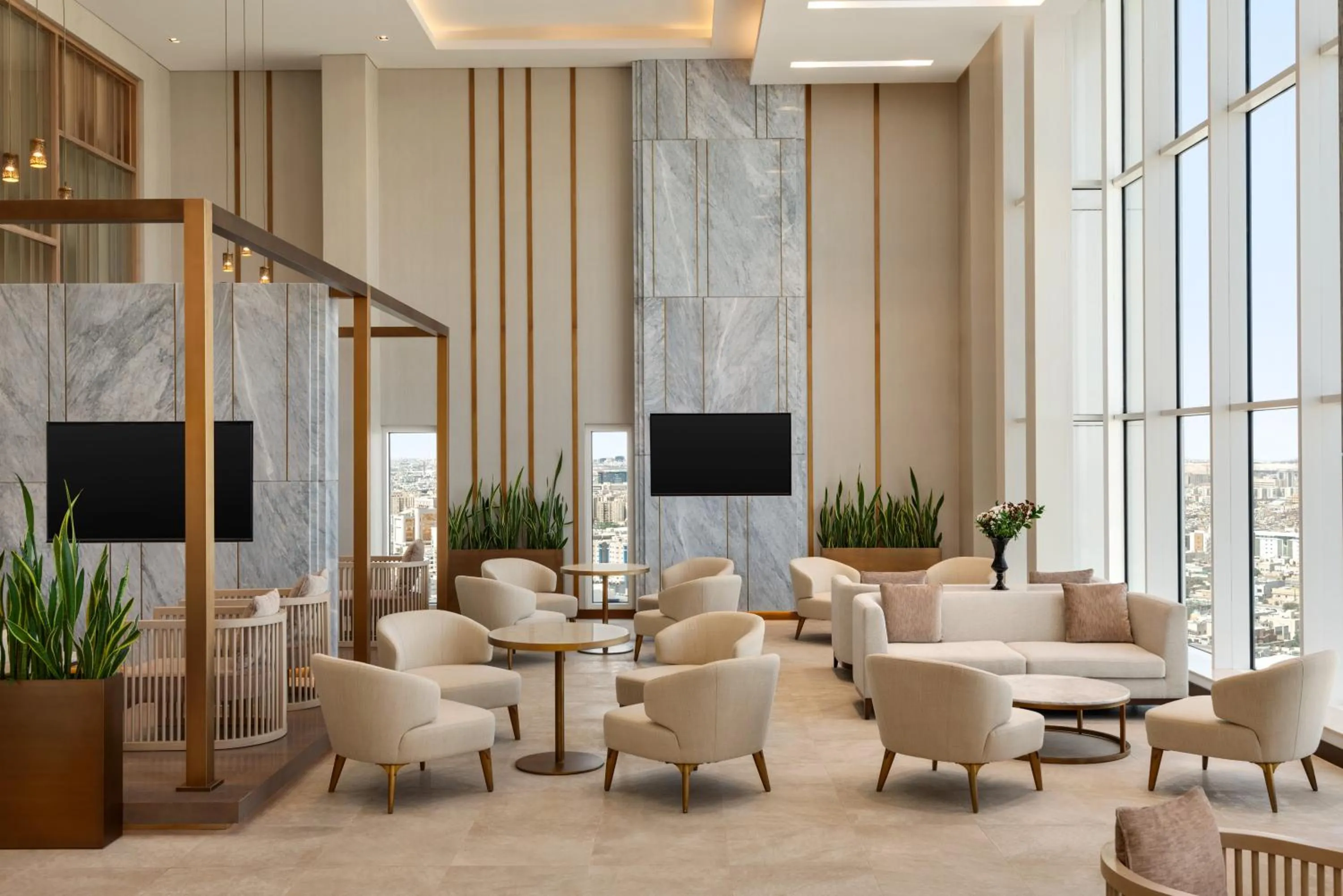 Communal lounge/ TV room in Ramada by Wyndham Riyadh King Fahd Road