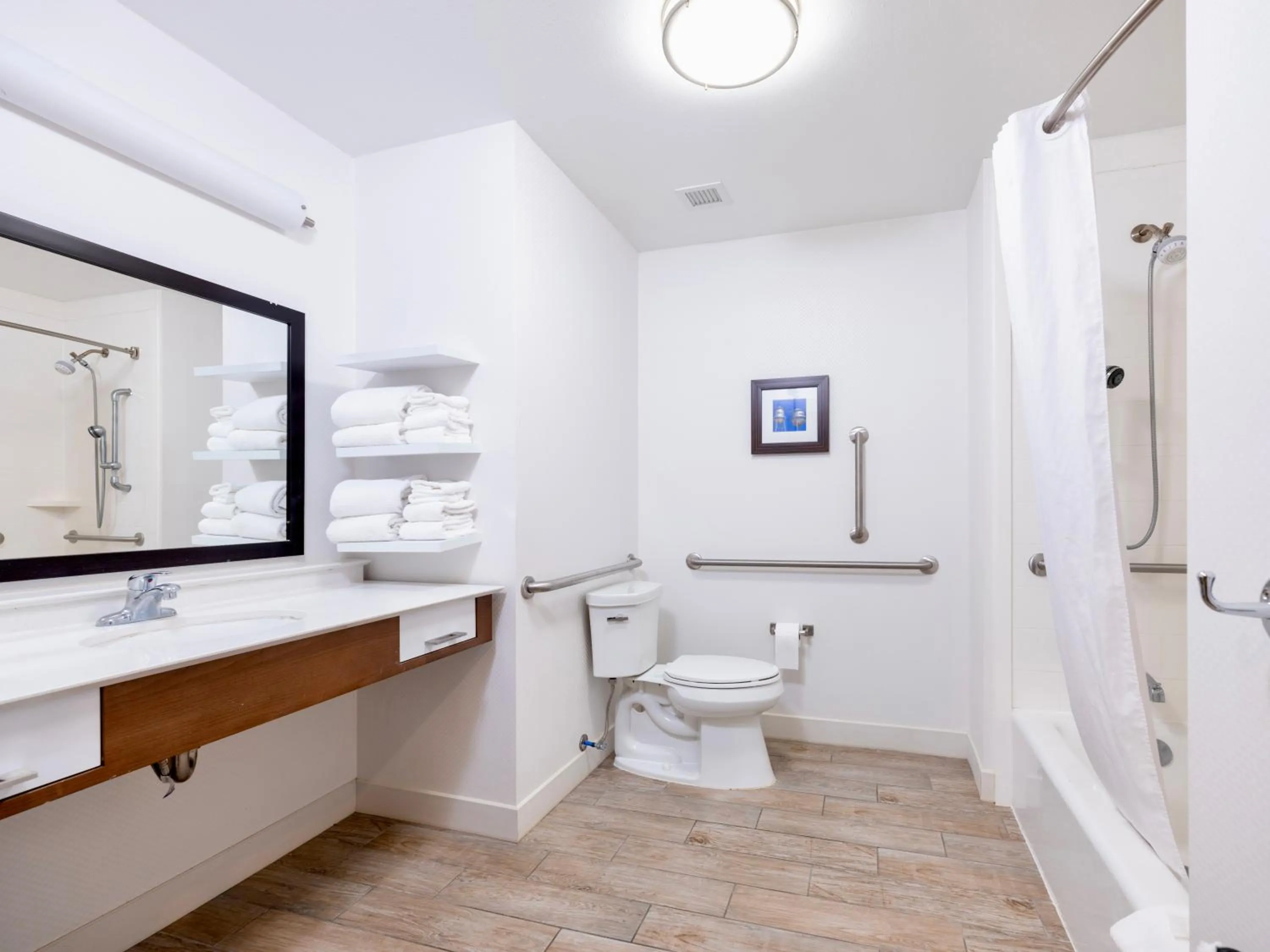 Bathroom in Flag Point Inn and Suites Pratt by FairBridge