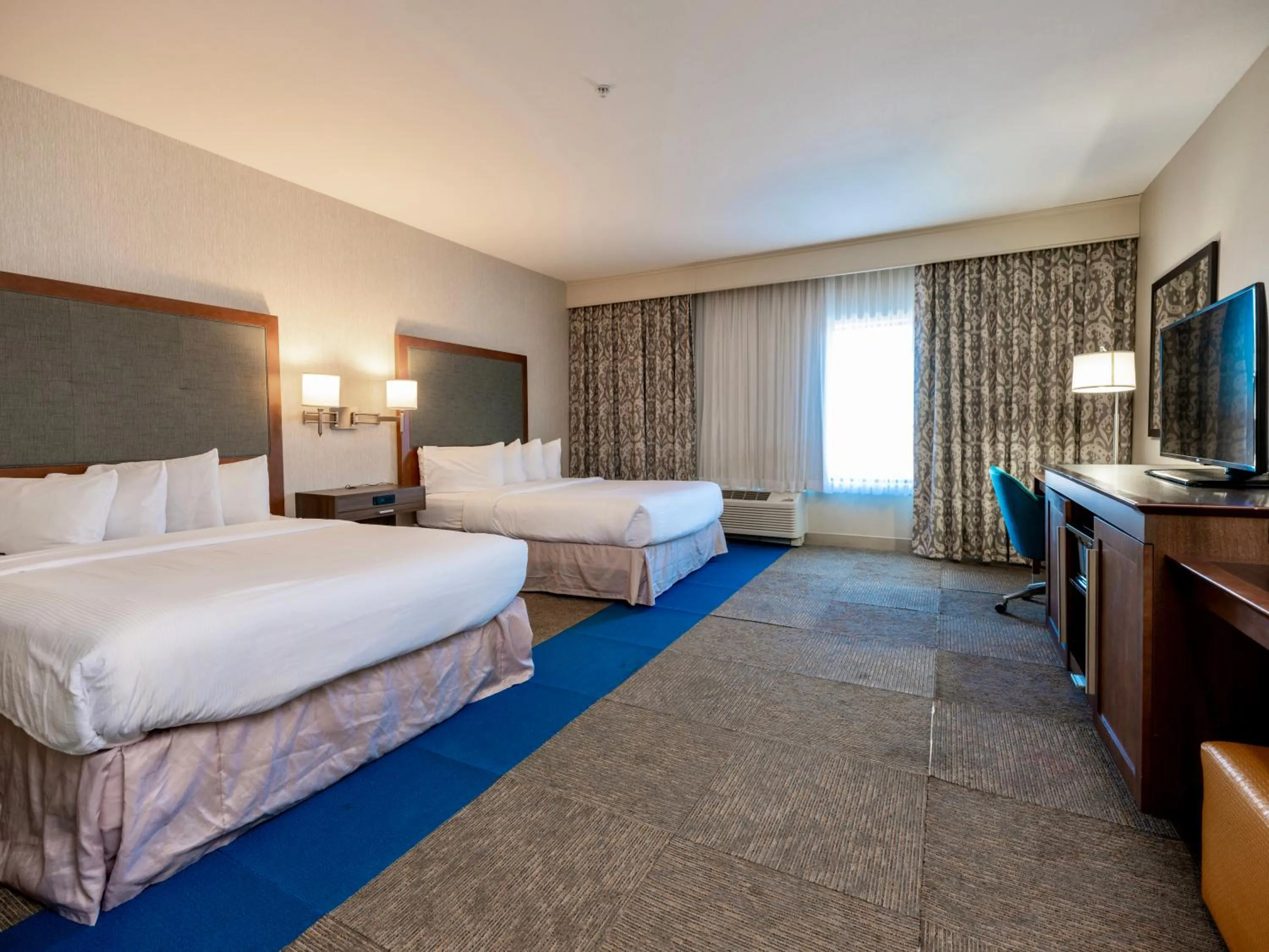 Photo of the whole room, Bed in Flag Point Inn and Suites Pratt by FairBridge