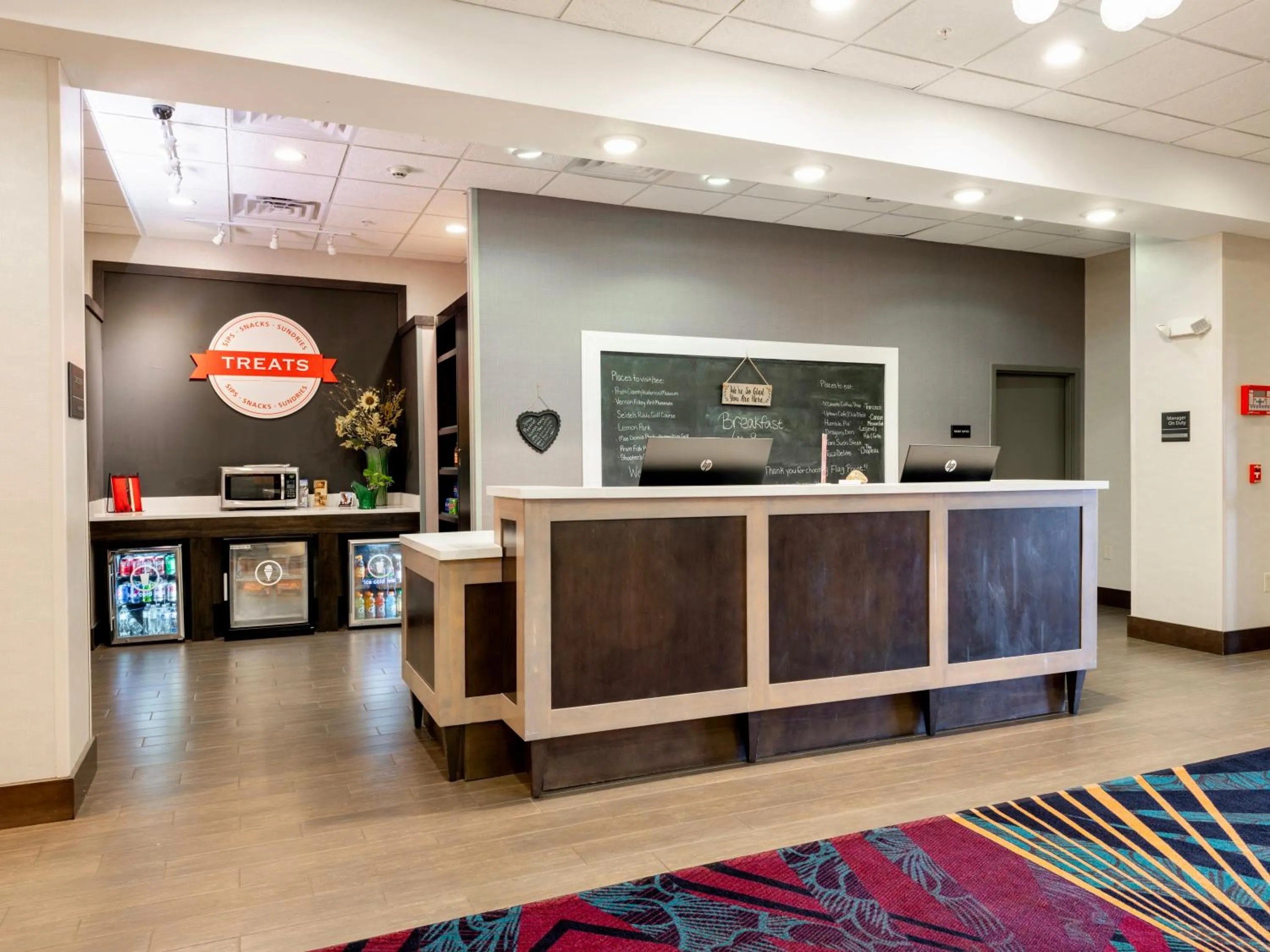 Lobby or reception in Flag Point Inn and Suites Pratt by FairBridge