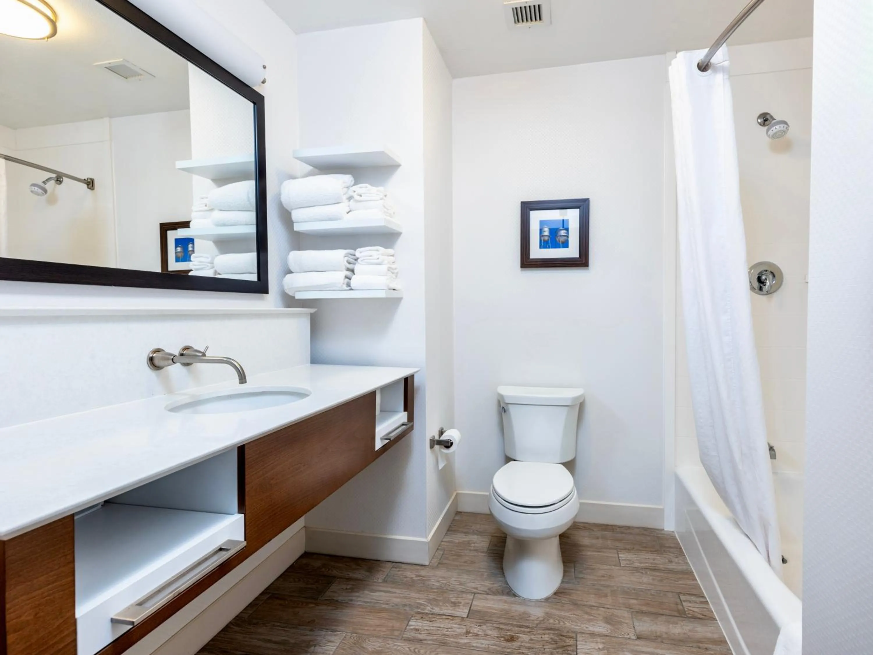 Bathroom in Flag Point Inn and Suites Pratt by FairBridge