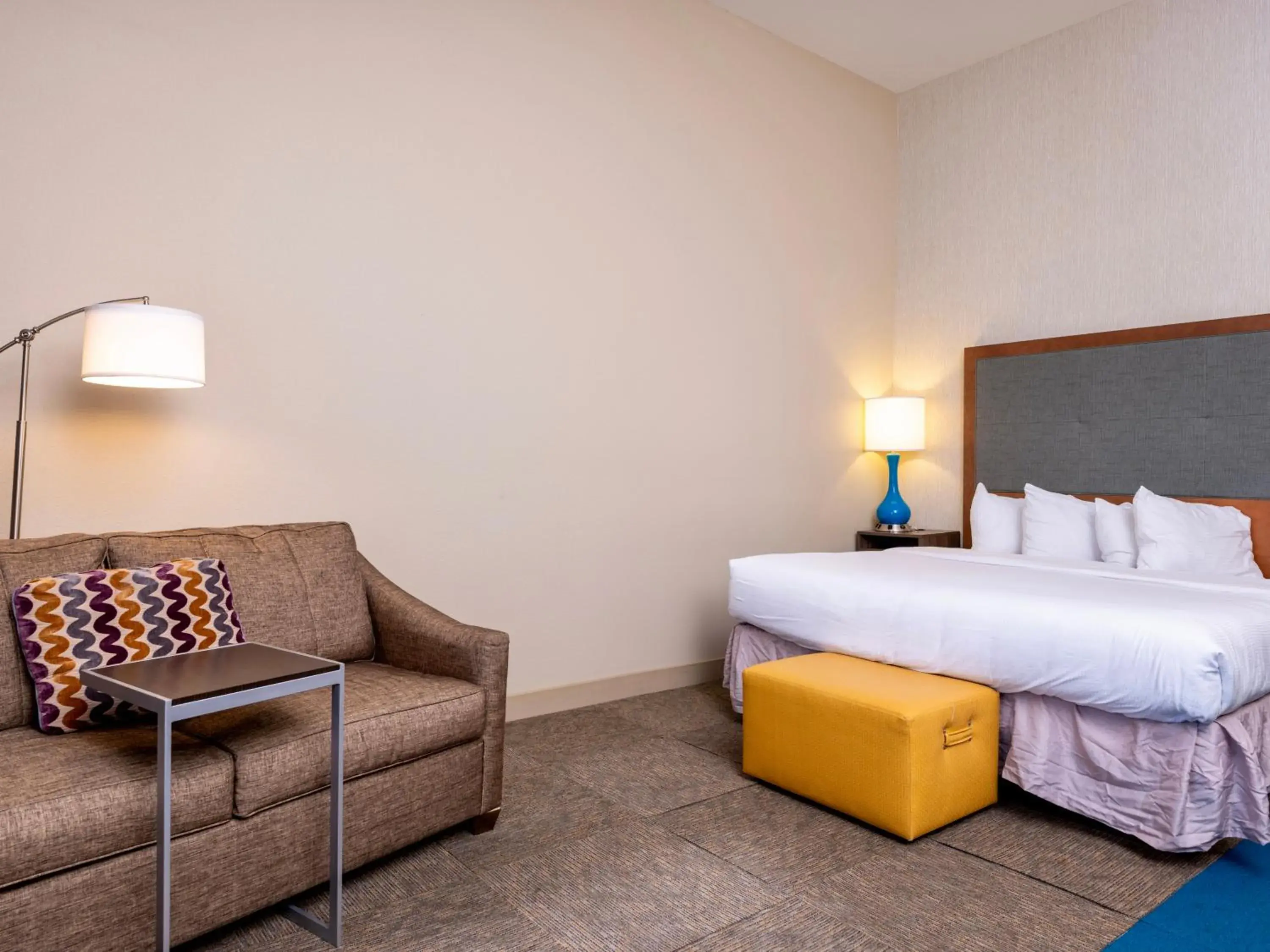 Bedroom, Bed in Flag Point Inn and Suites Pratt by FairBridge Bedroom, Bed in Flag Point Inn and Suites Pratt by FairBridge