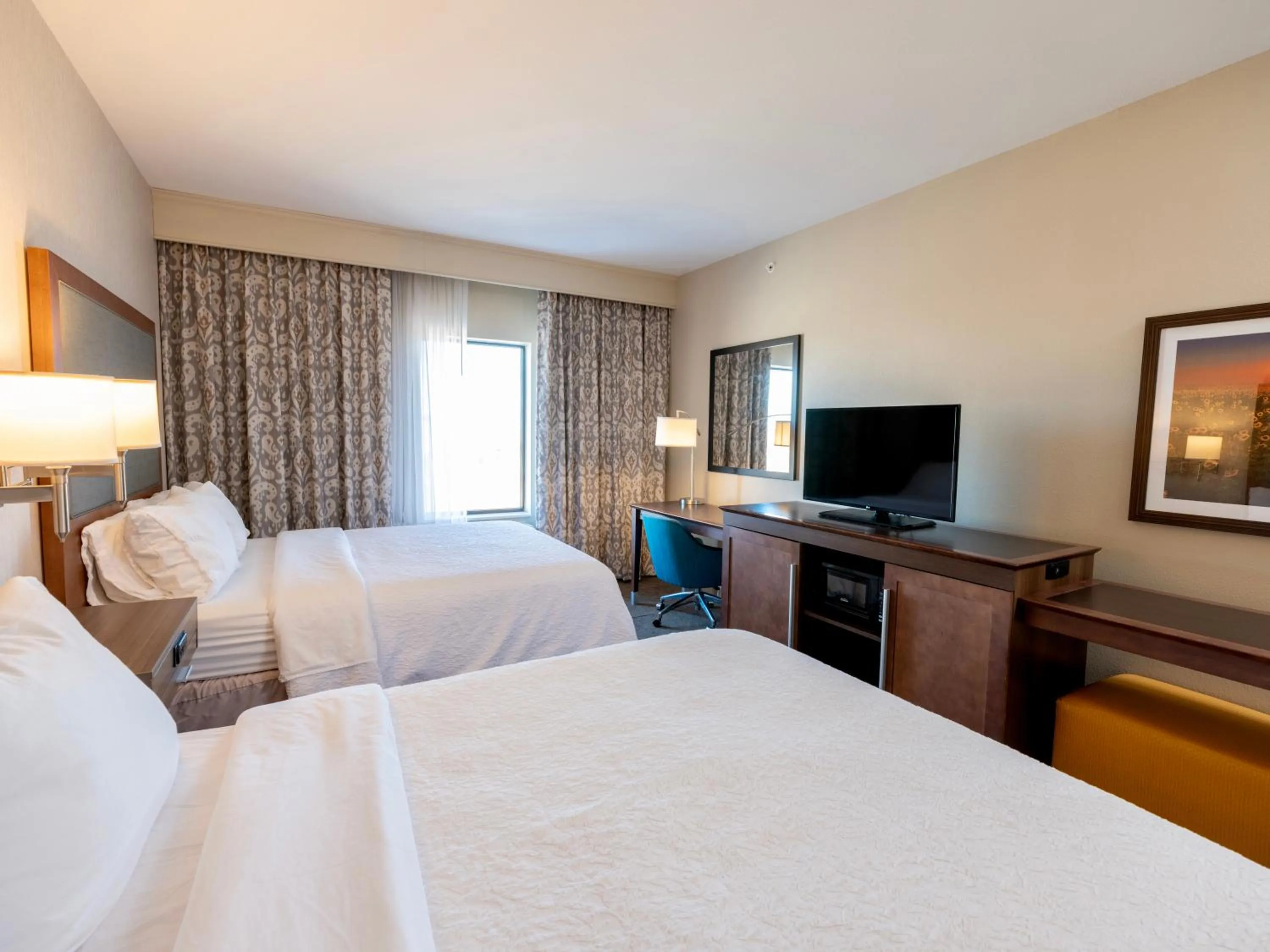 Bedroom, Bed in Flag Point Inn and Suites Pratt by FairBridge