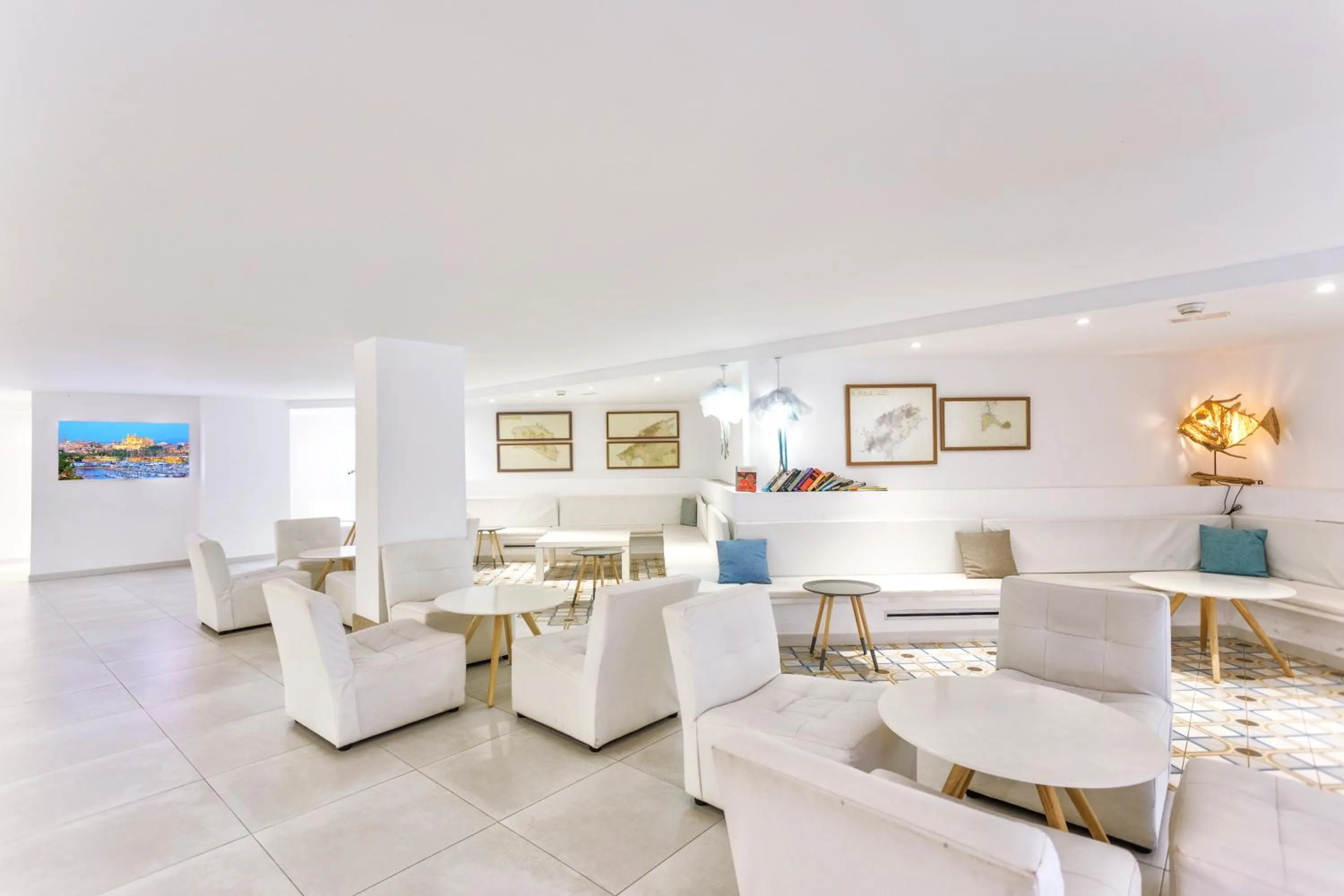 Communal lounge/ TV room in FERGUS Style Cala Blanca Suites