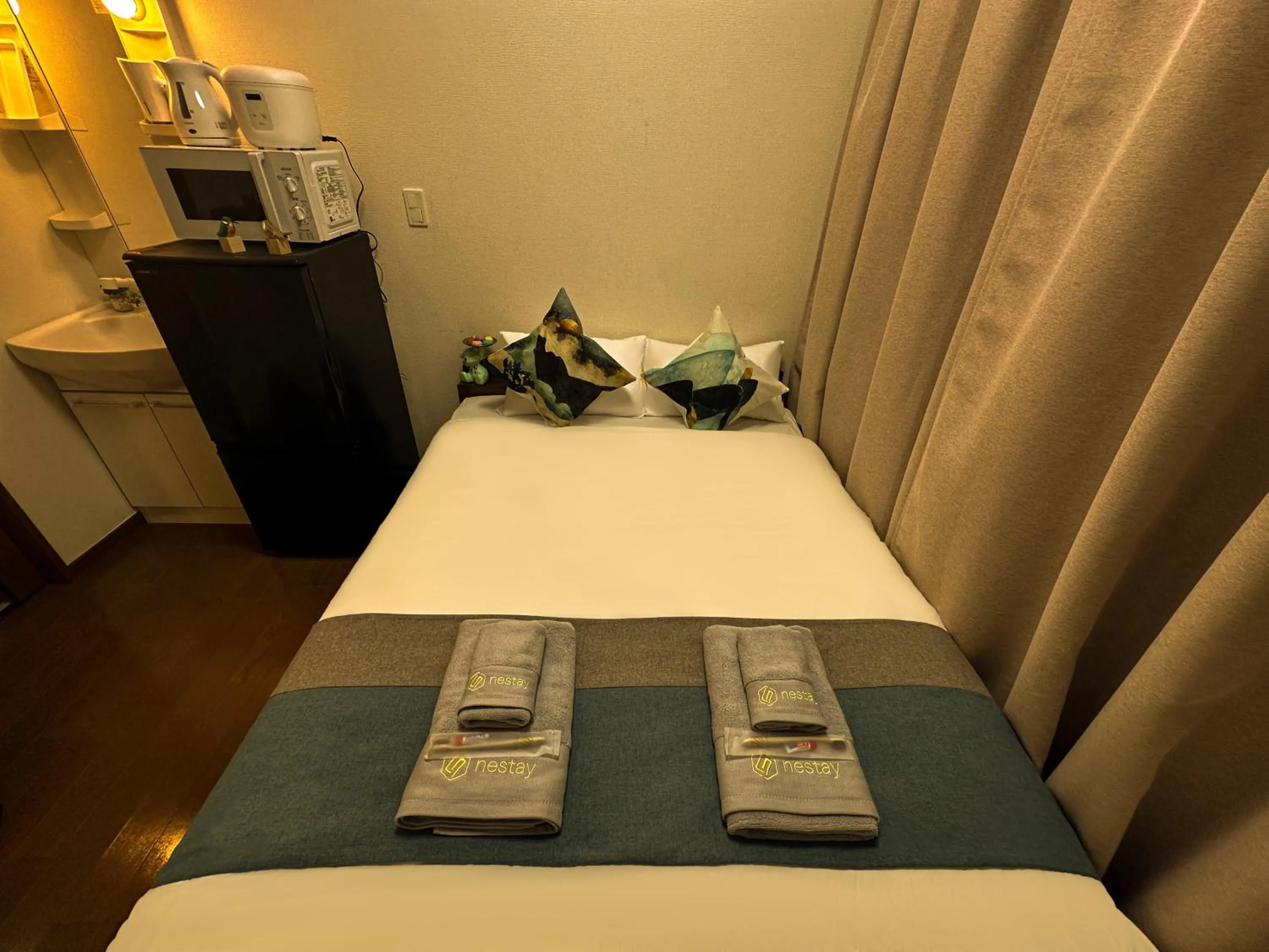 Bed in nestay suite tokyo ikebukuro