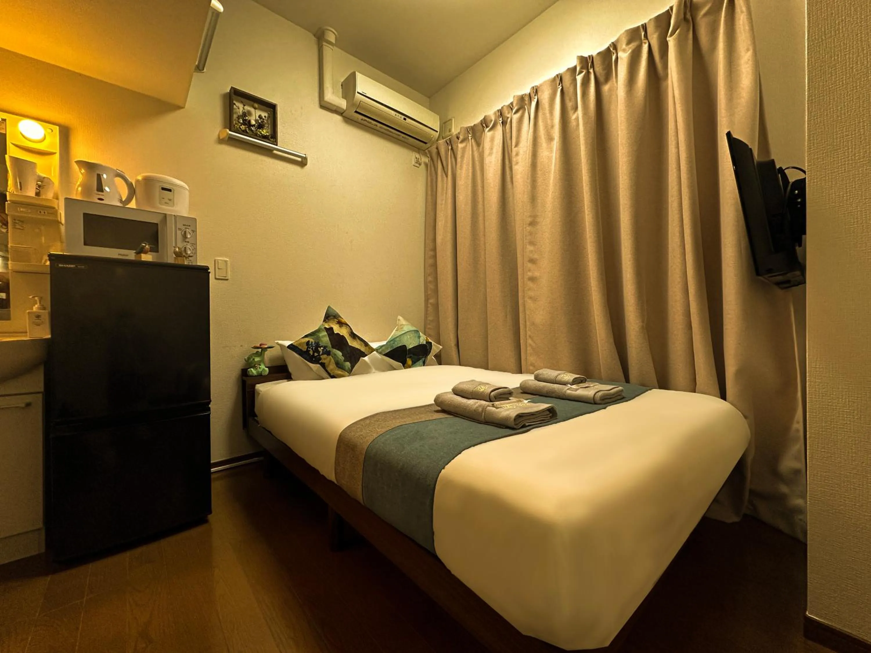 Bed in nestay suite tokyo ikebukuro