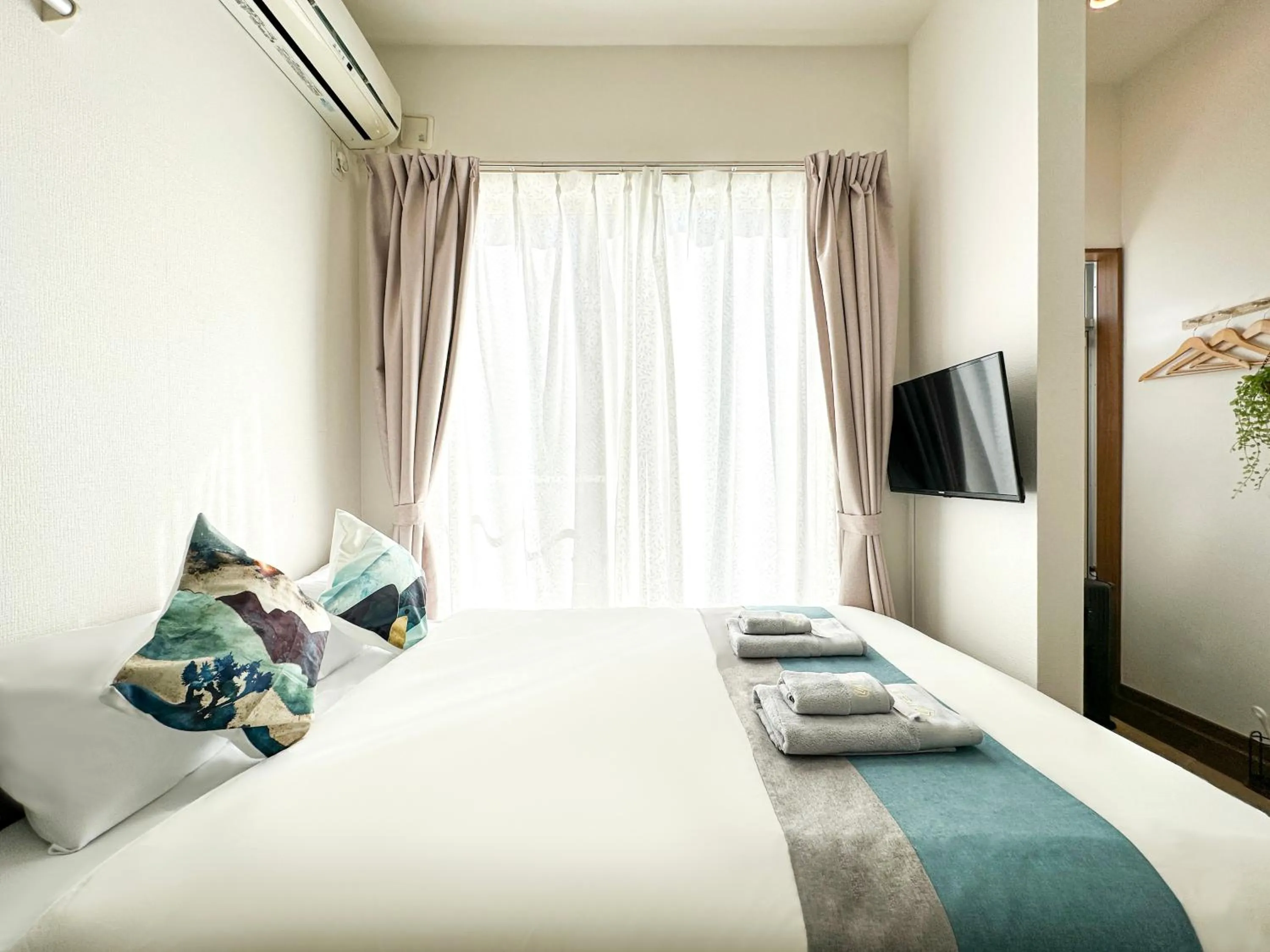 Bed in nestay suite tokyo ikebukuro