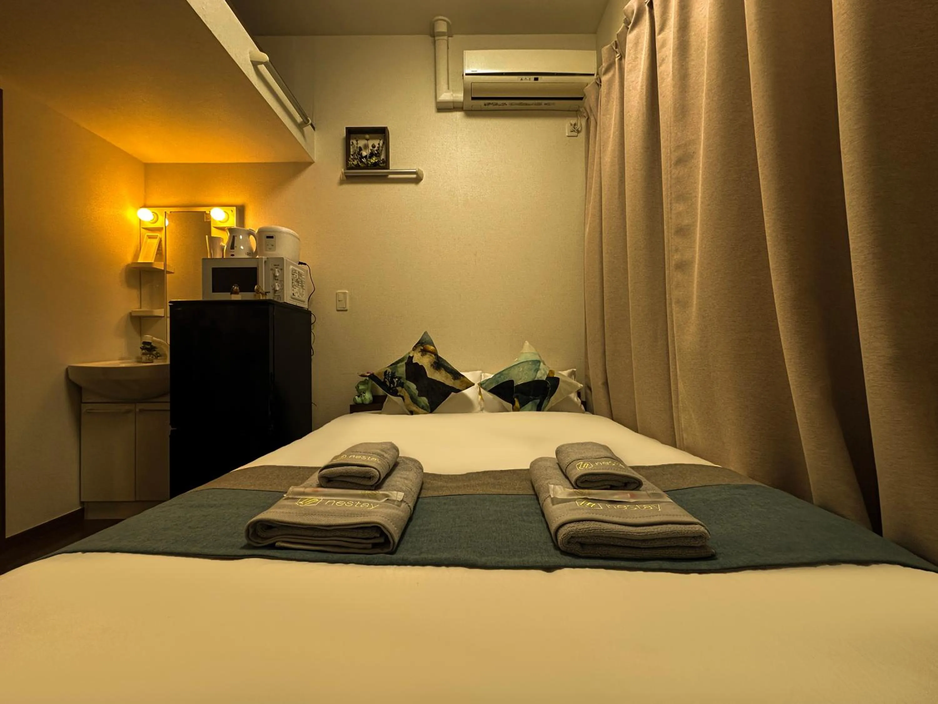 Bed in nestay suite tokyo ikebukuro