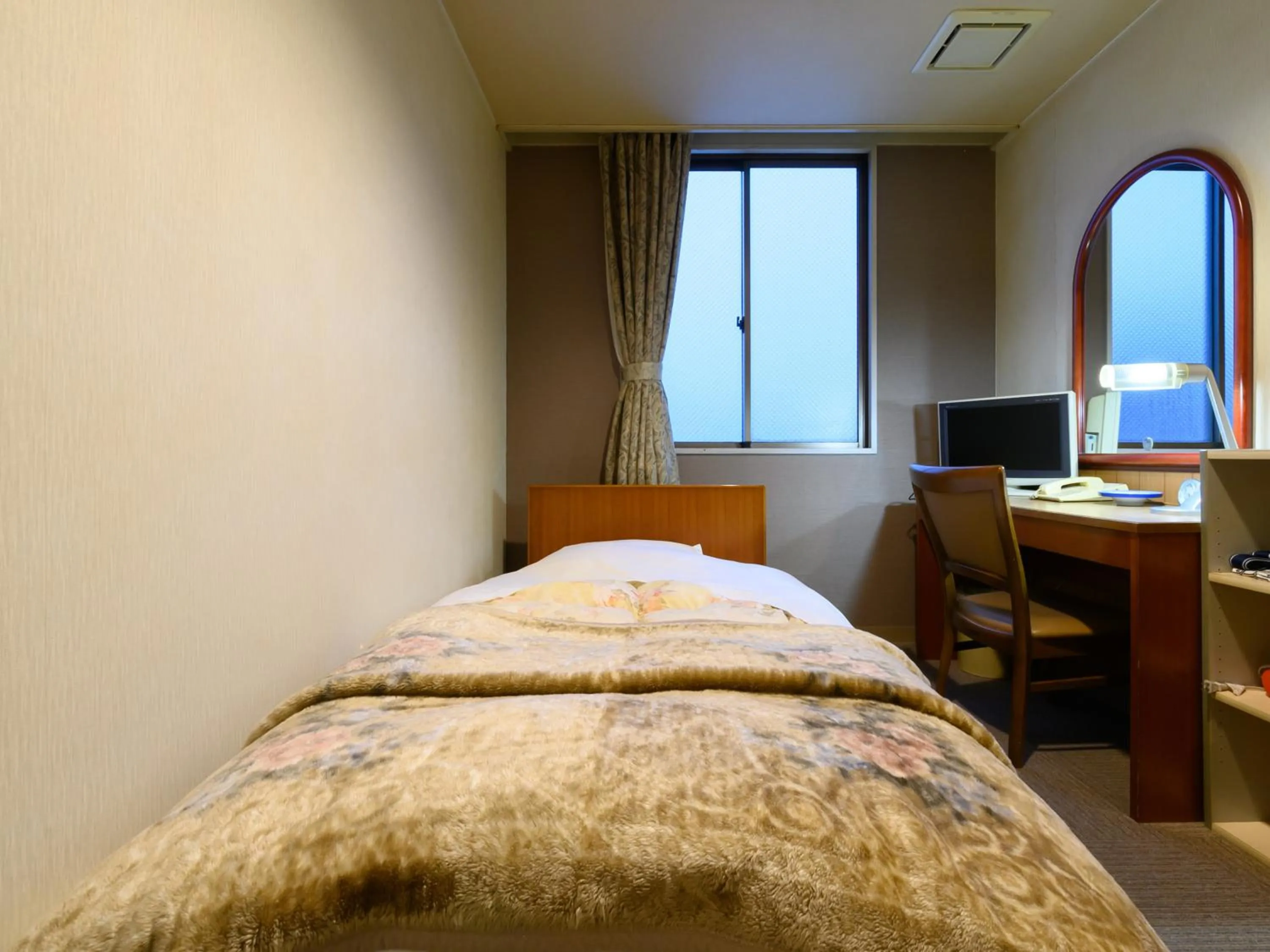 Bed in Tabist Business Ryokan Hotel Yukimiso