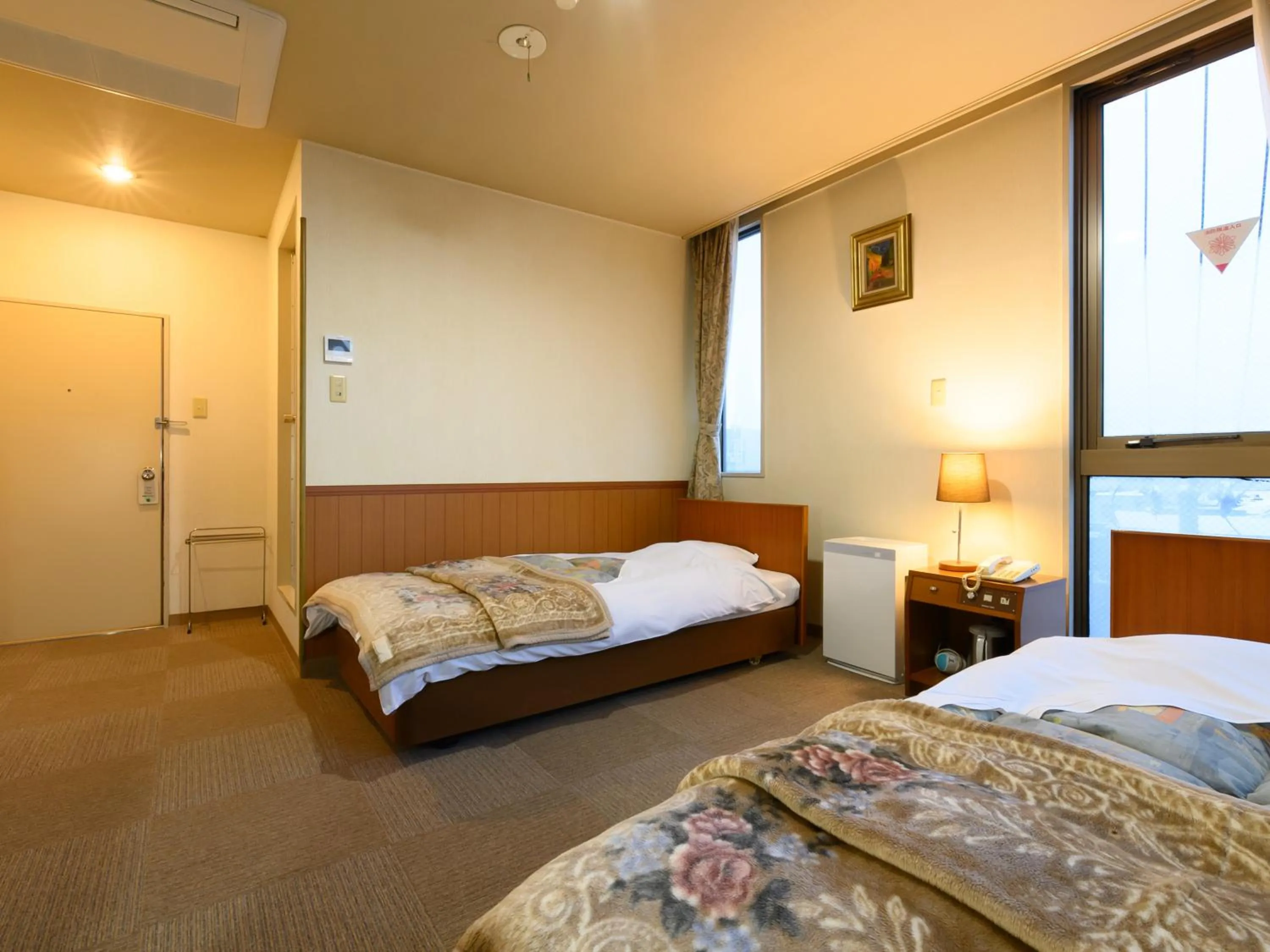 Bed in Tabist Business Ryokan Hotel Yukimiso