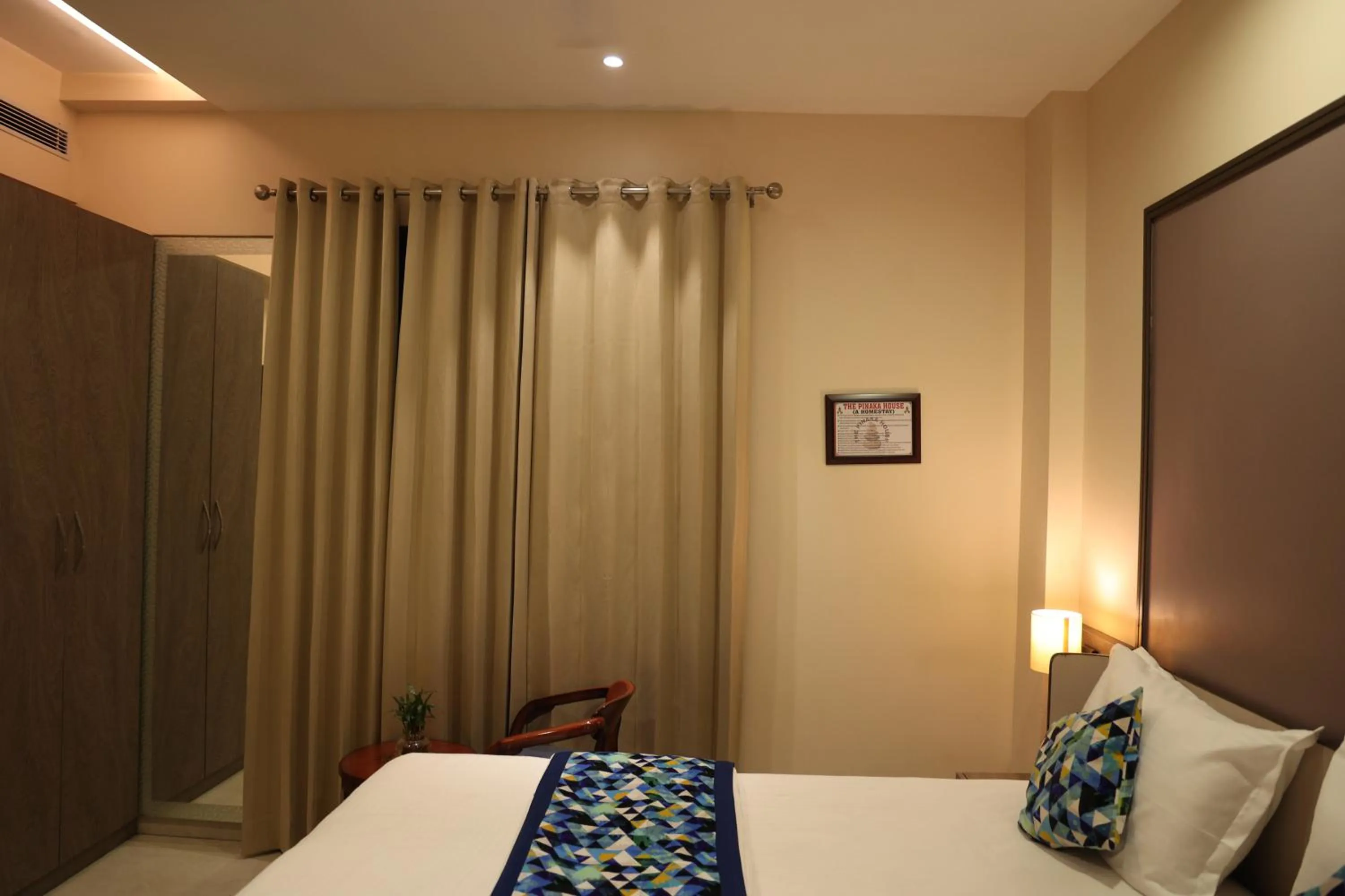 Bed in Hotel Pinaka Inn