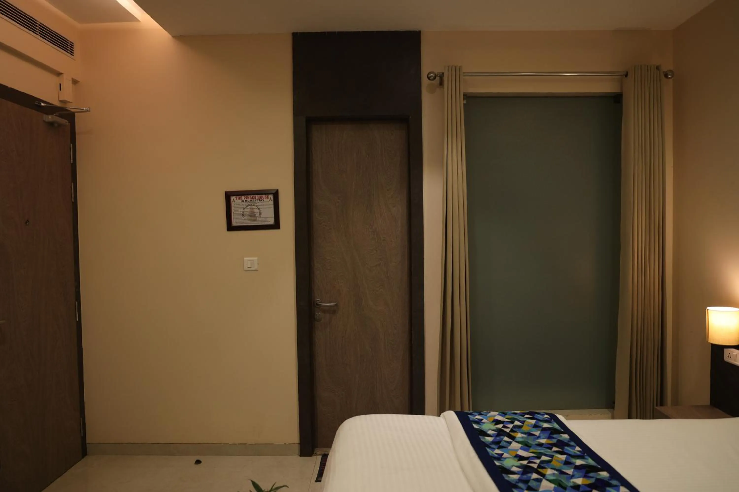 Bed in Hotel Pinaka Inn