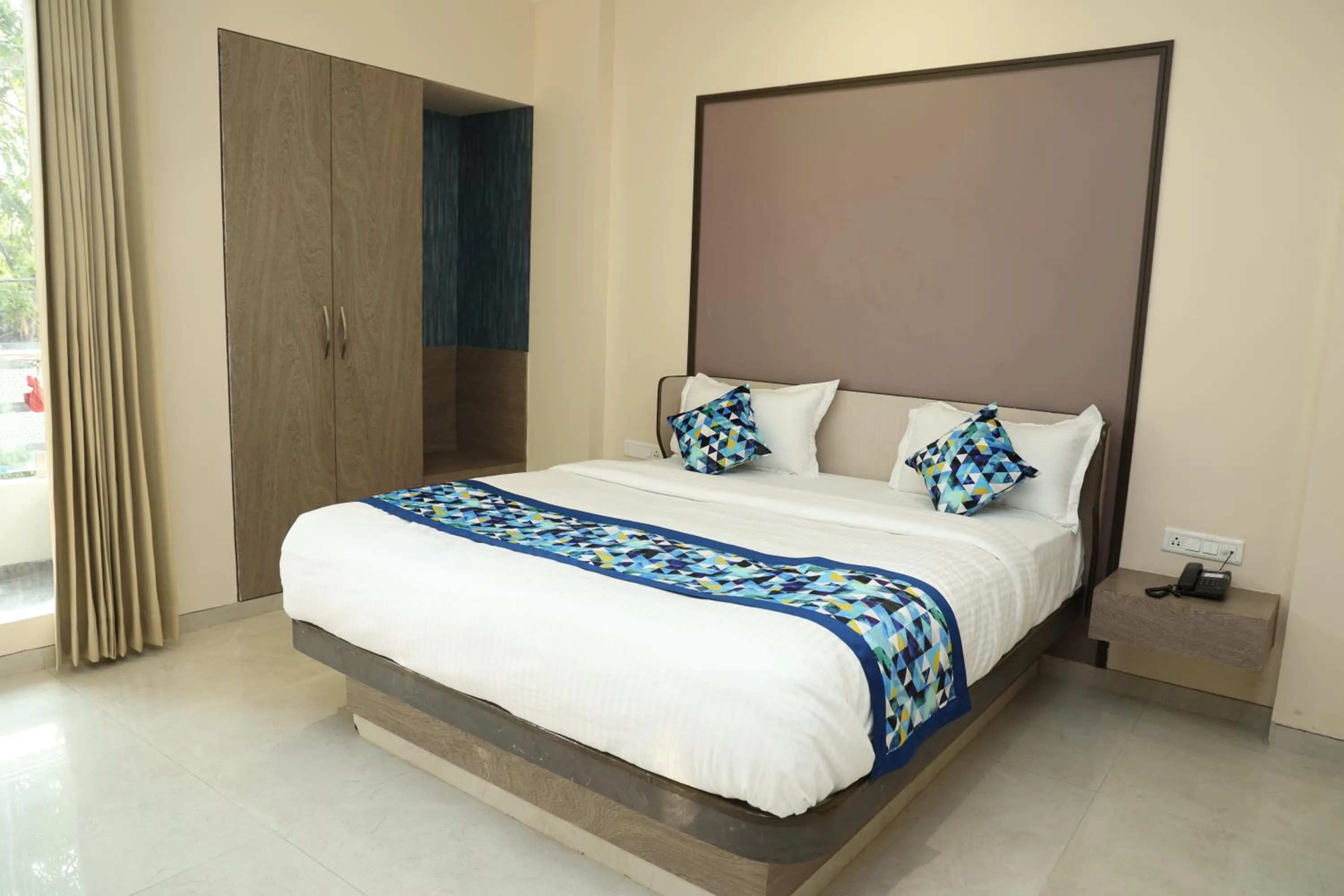 Bed in Hotel Pinaka Inn