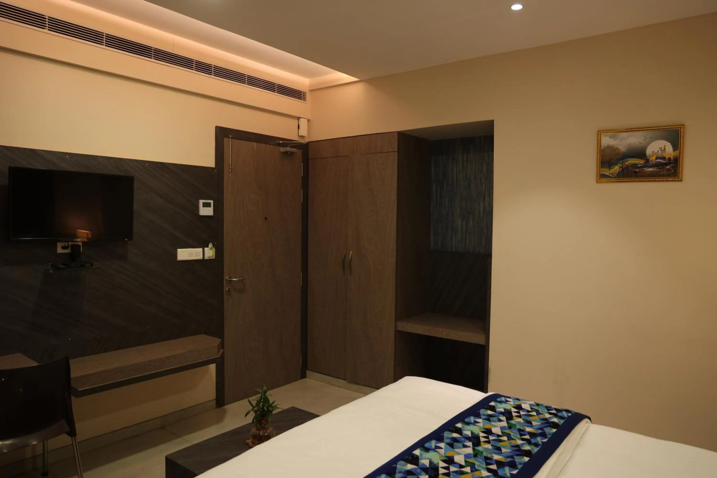 Bed in Hotel Pinaka Inn