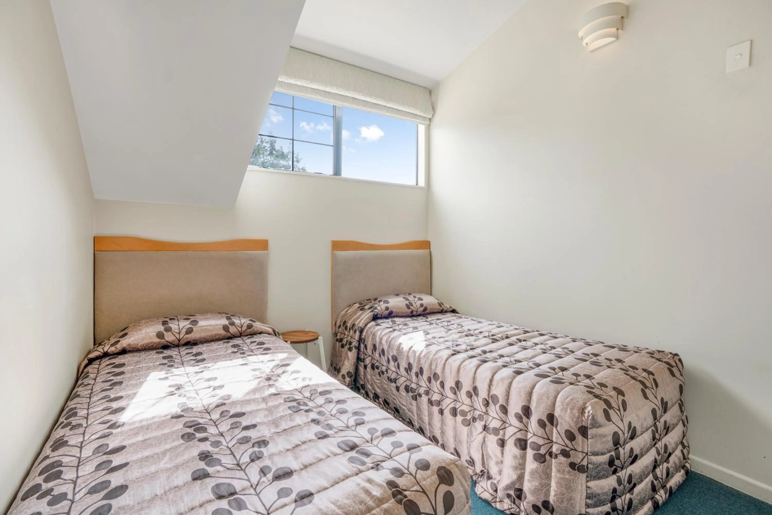 Bed in Capital Lodge Motor Inn