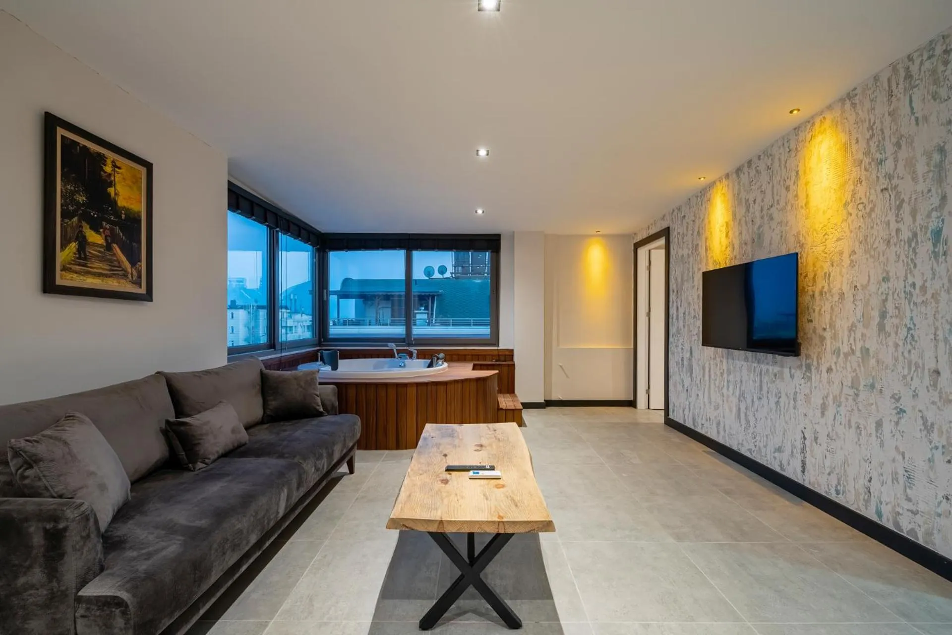 Communal lounge/ TV room in ELUXİO SUİTE HOTEL