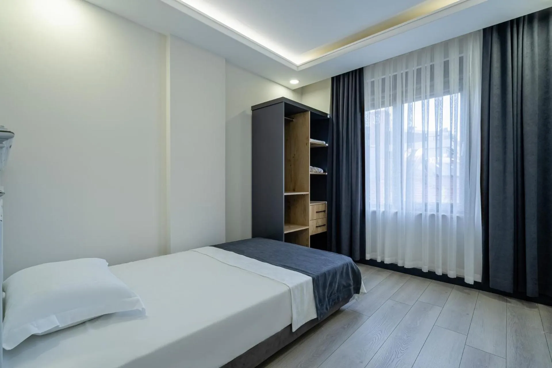 Bed in ELUXİO SUİTE HOTEL