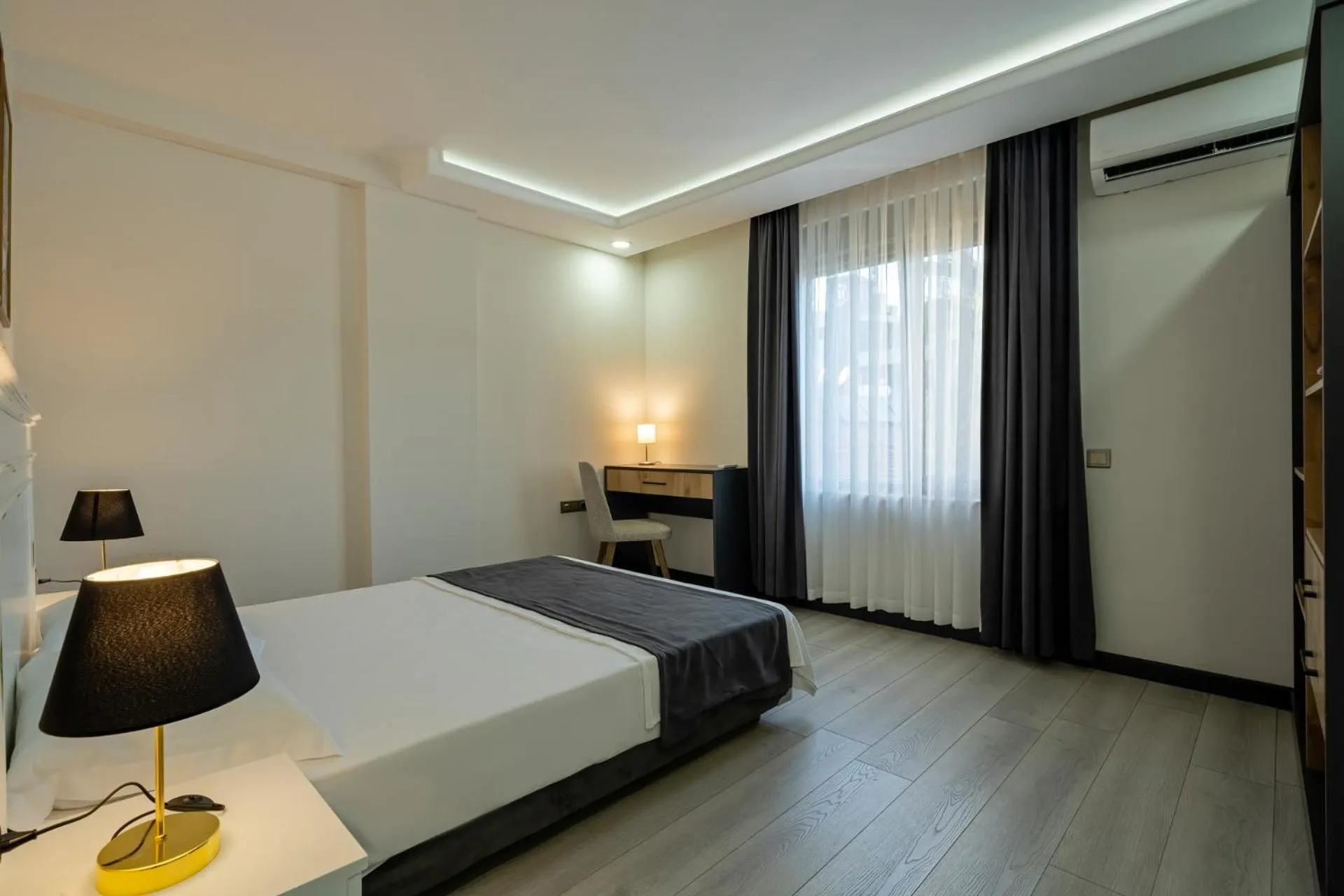Bed in ELUXİO SUİTE HOTEL