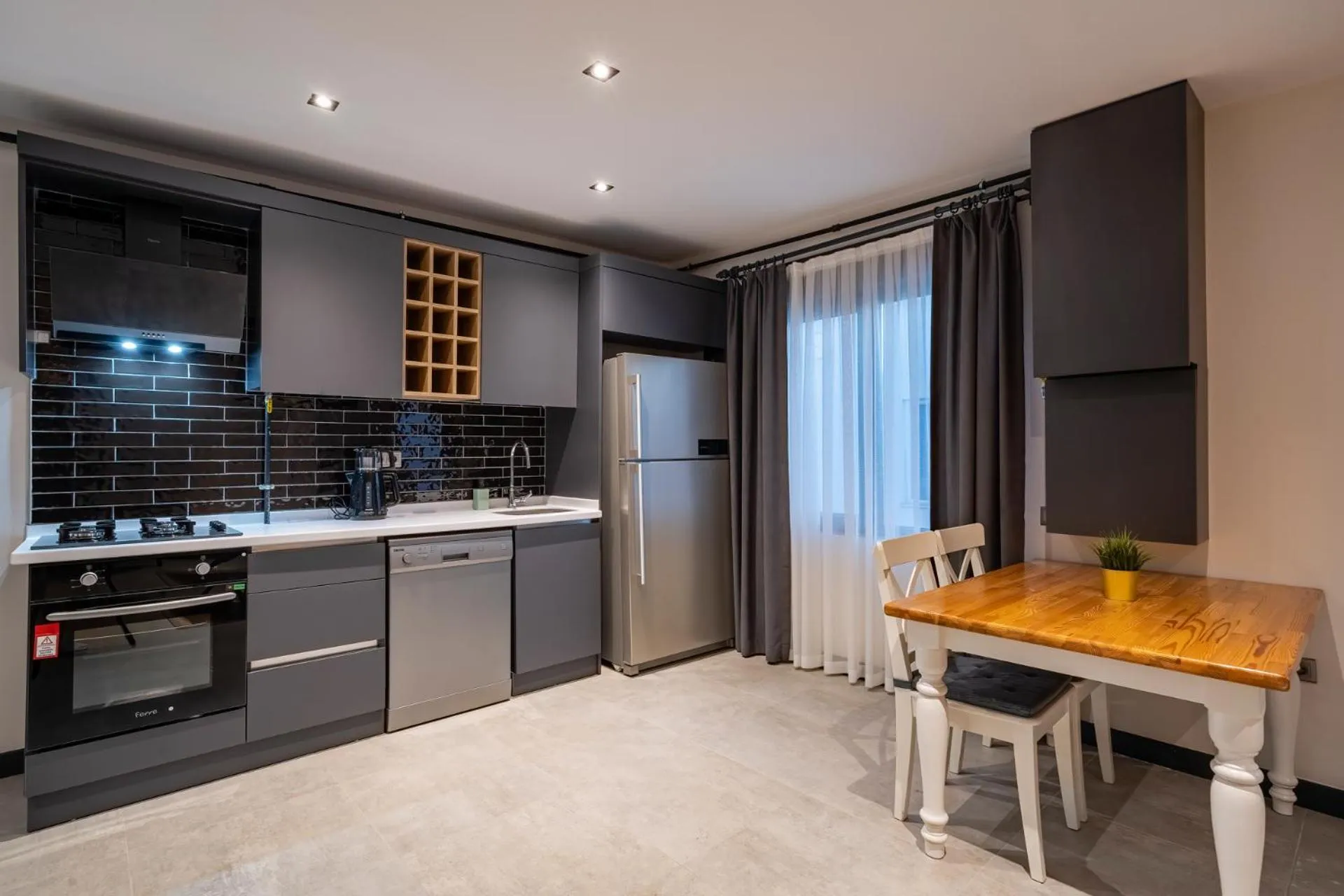 Kitchen or kitchenette in ELUXİO SUİTE HOTEL