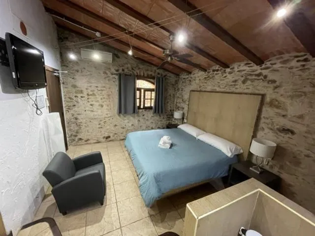 Bed in Hotel Mas Palou