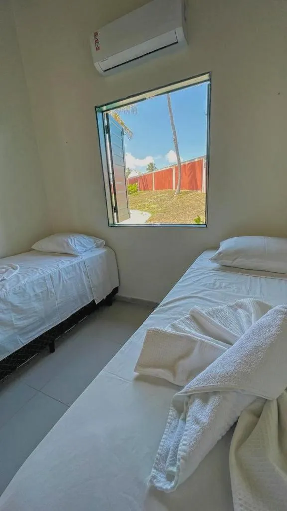 Bed in Pousada Paradise