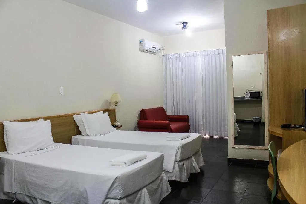 Bed in Bravo Suites São Carlos