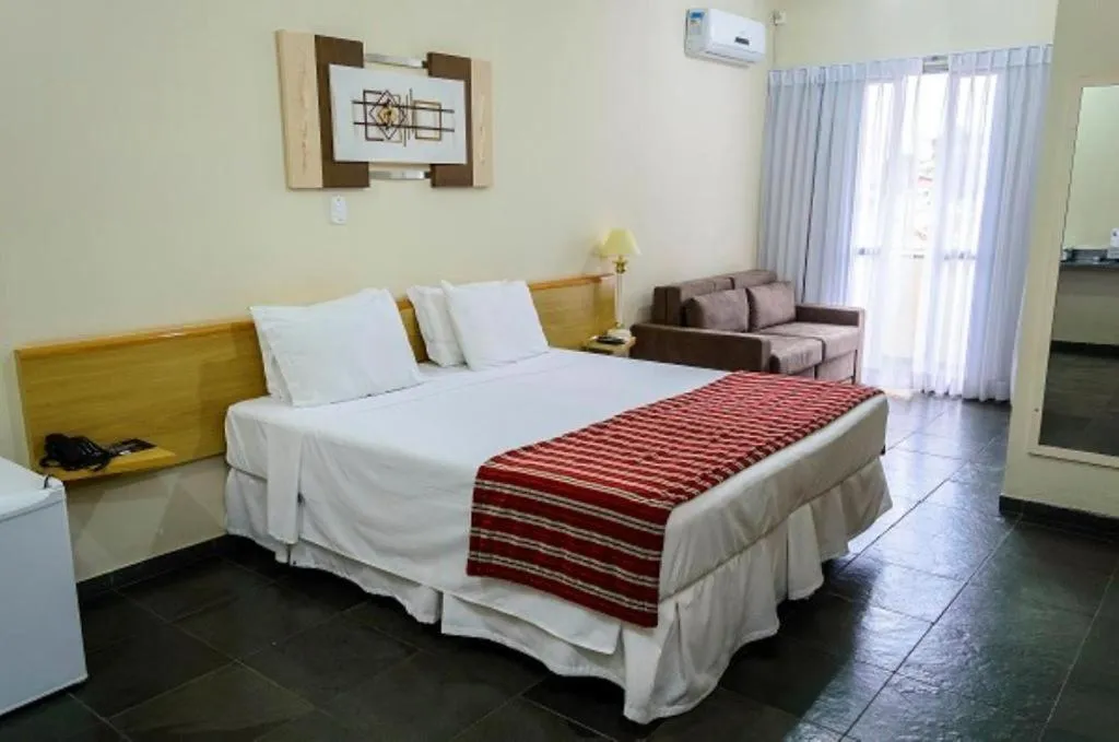 Bed in Bravo Suites São Carlos