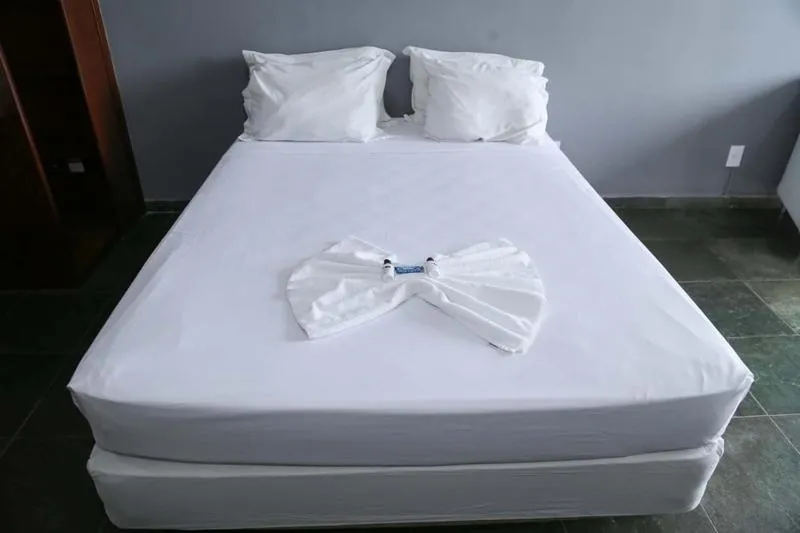 Bed in Bravo Suites São Carlos