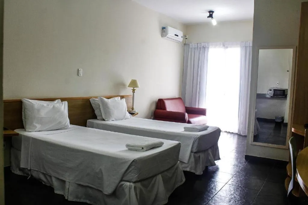 Bed in Bravo Suites São Carlos