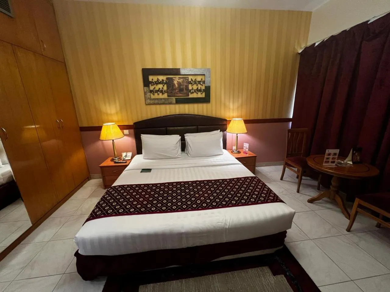 Bed in NEW CALIFORNIA HOTEL