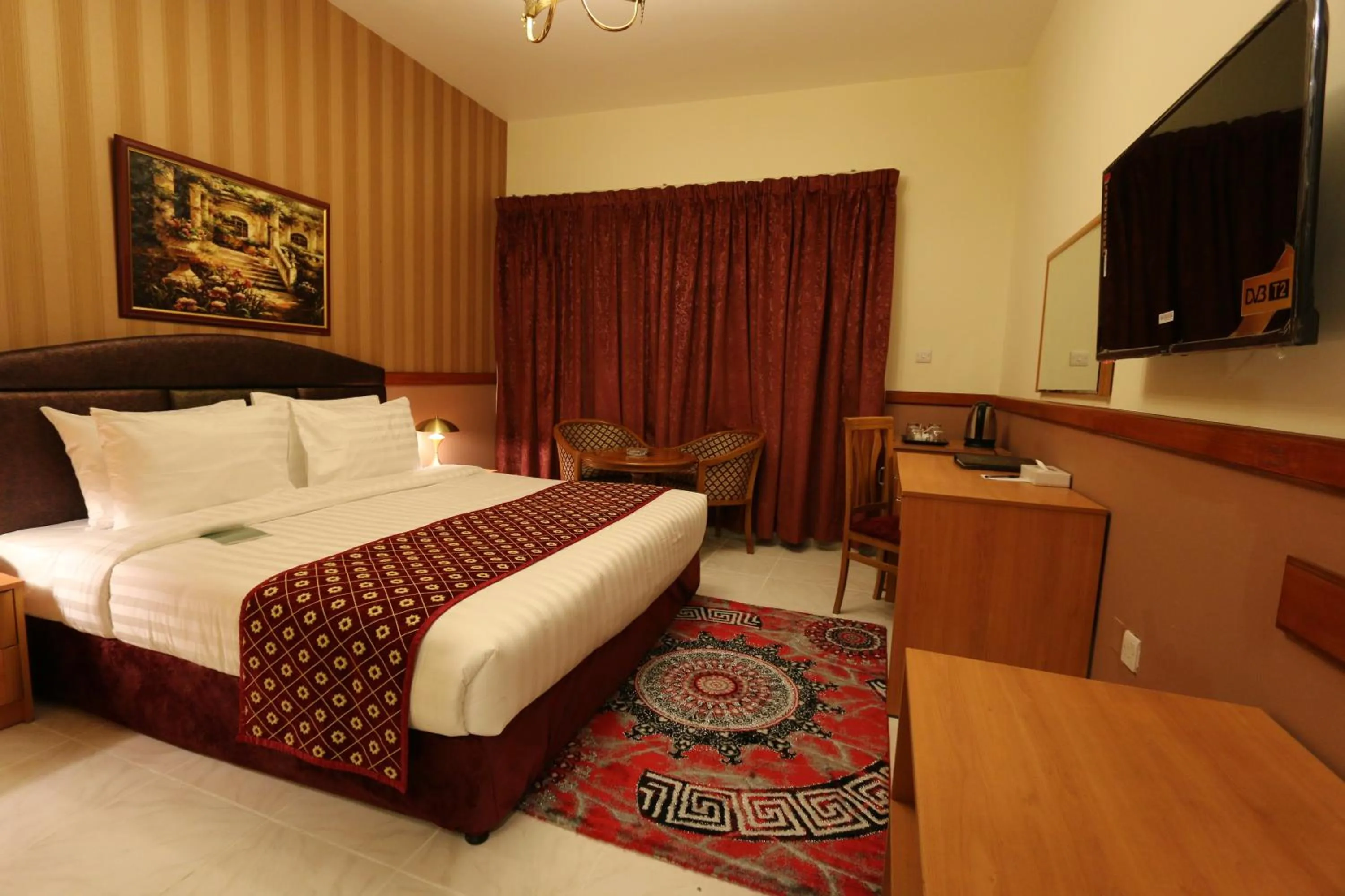 Bed in NEW CALIFORNIA HOTEL