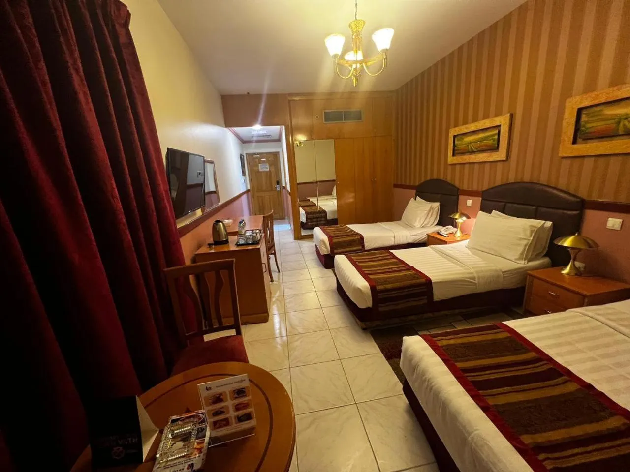 Bed in NEW CALIFORNIA HOTEL