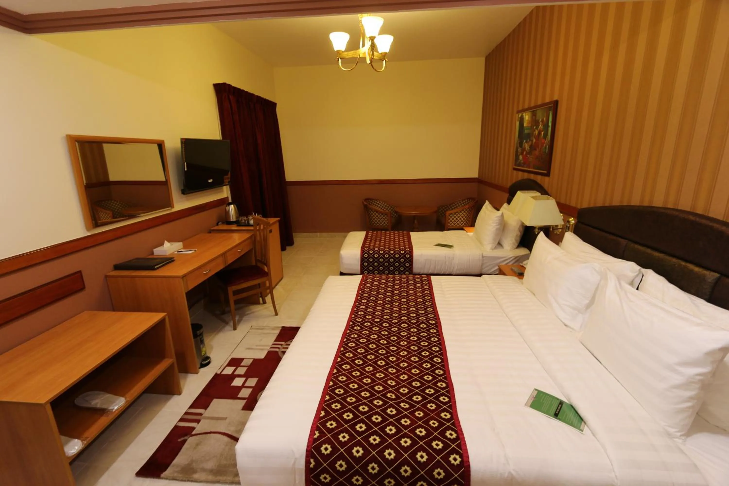 Bed in NEW CALIFORNIA HOTEL