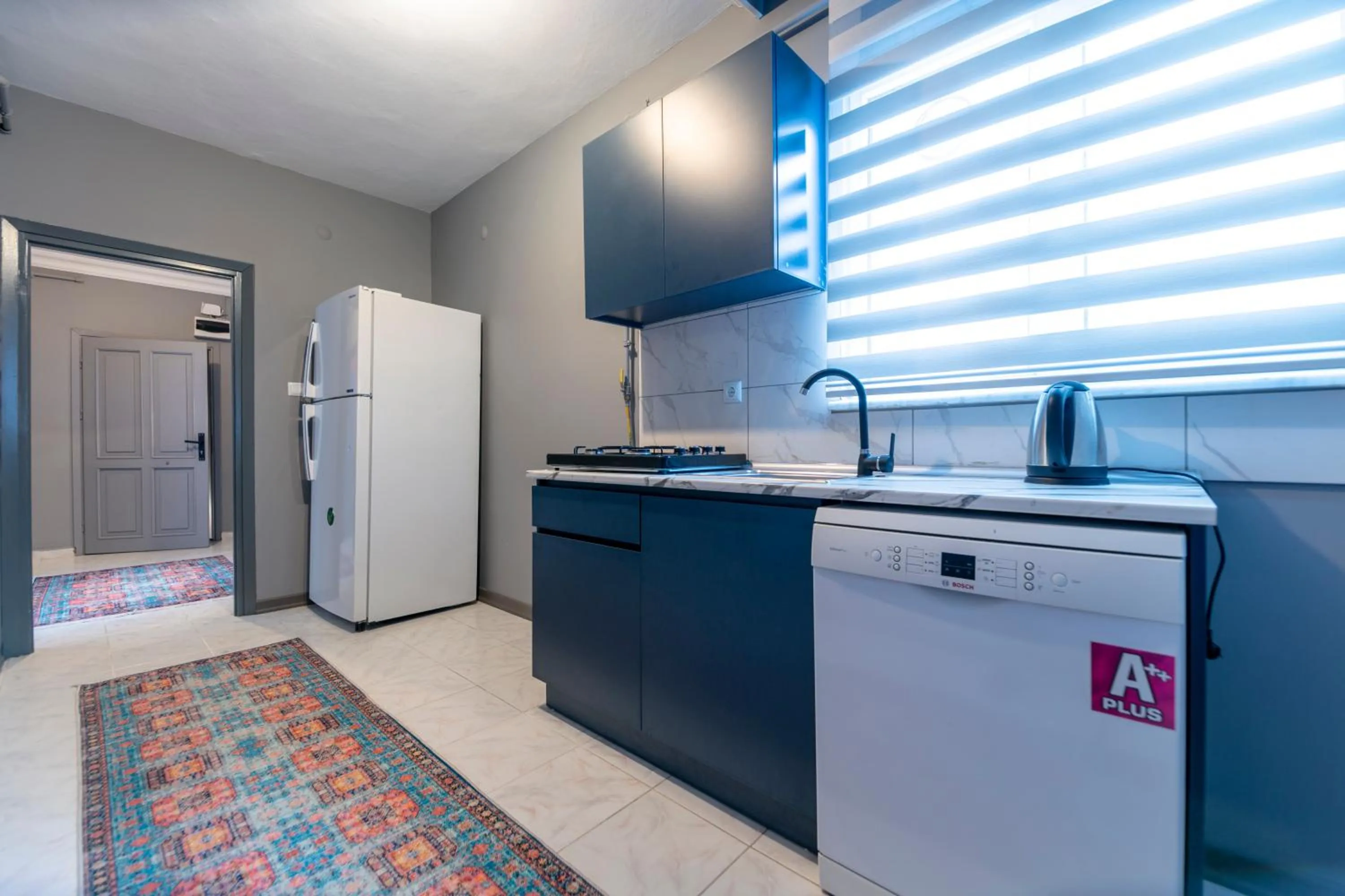 Kitchen or kitchenette in Hexa Suites Hotel