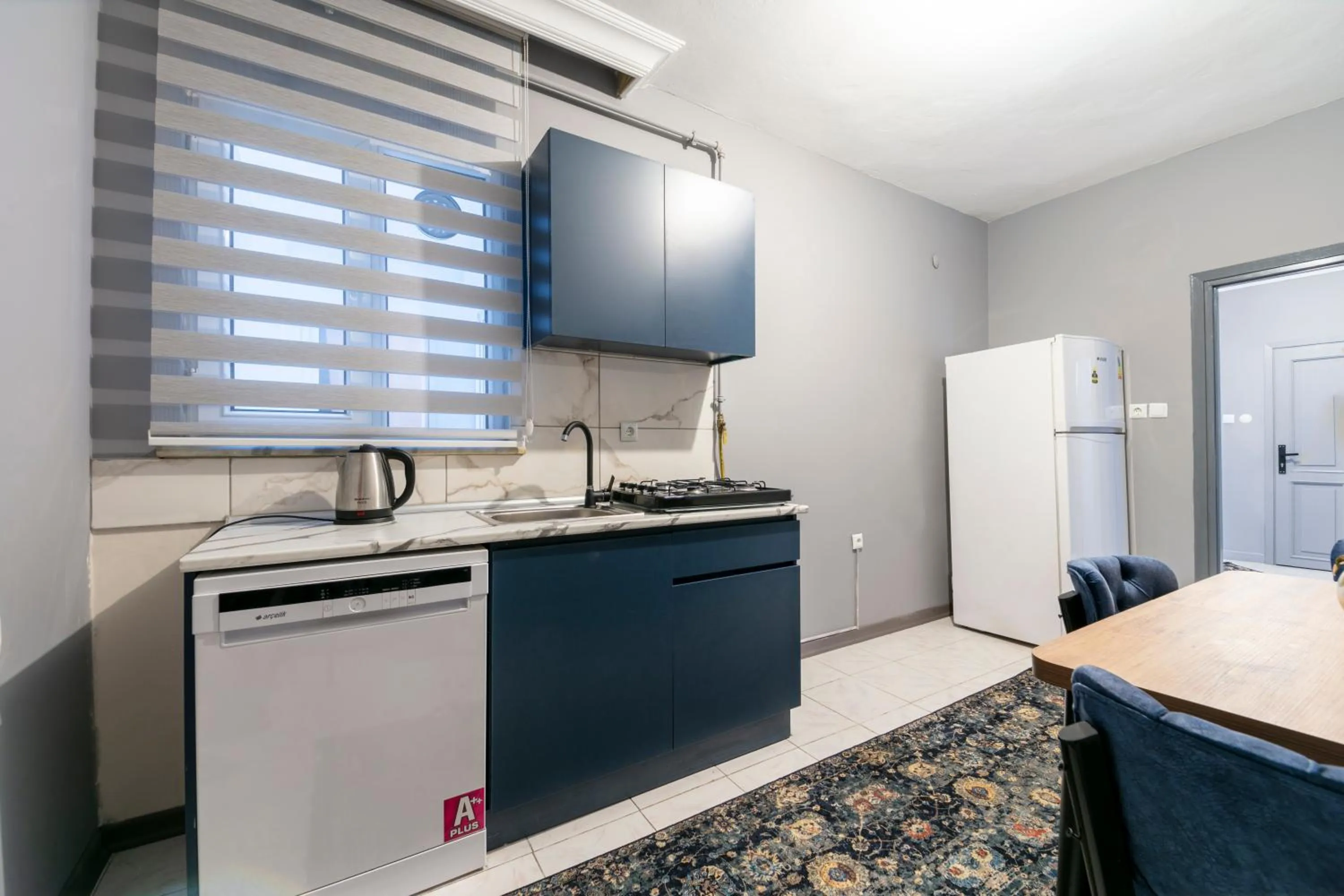 Kitchen or kitchenette in Hexa Suites Hotel