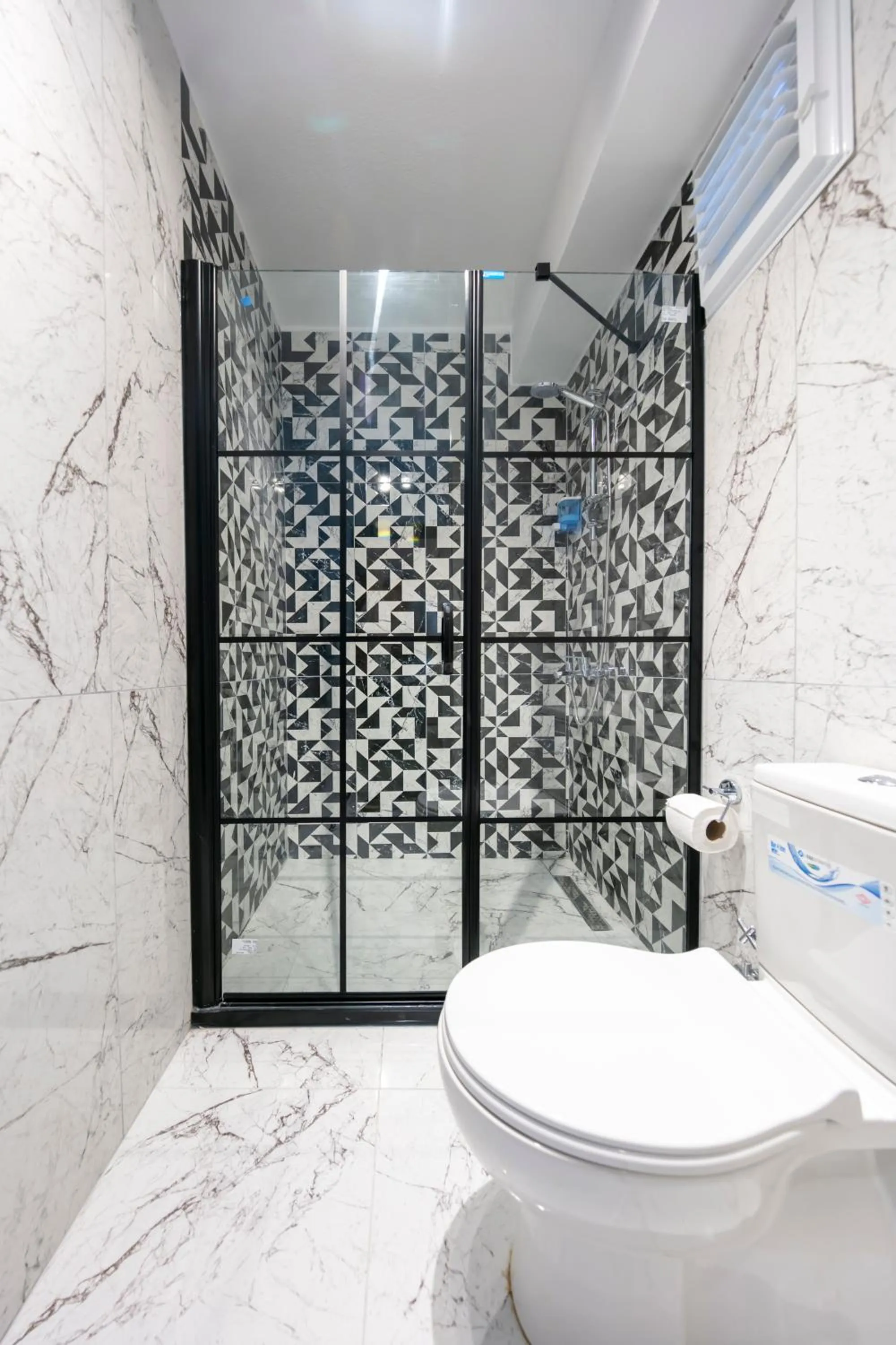 Toilet in Hexa Suites Hotel