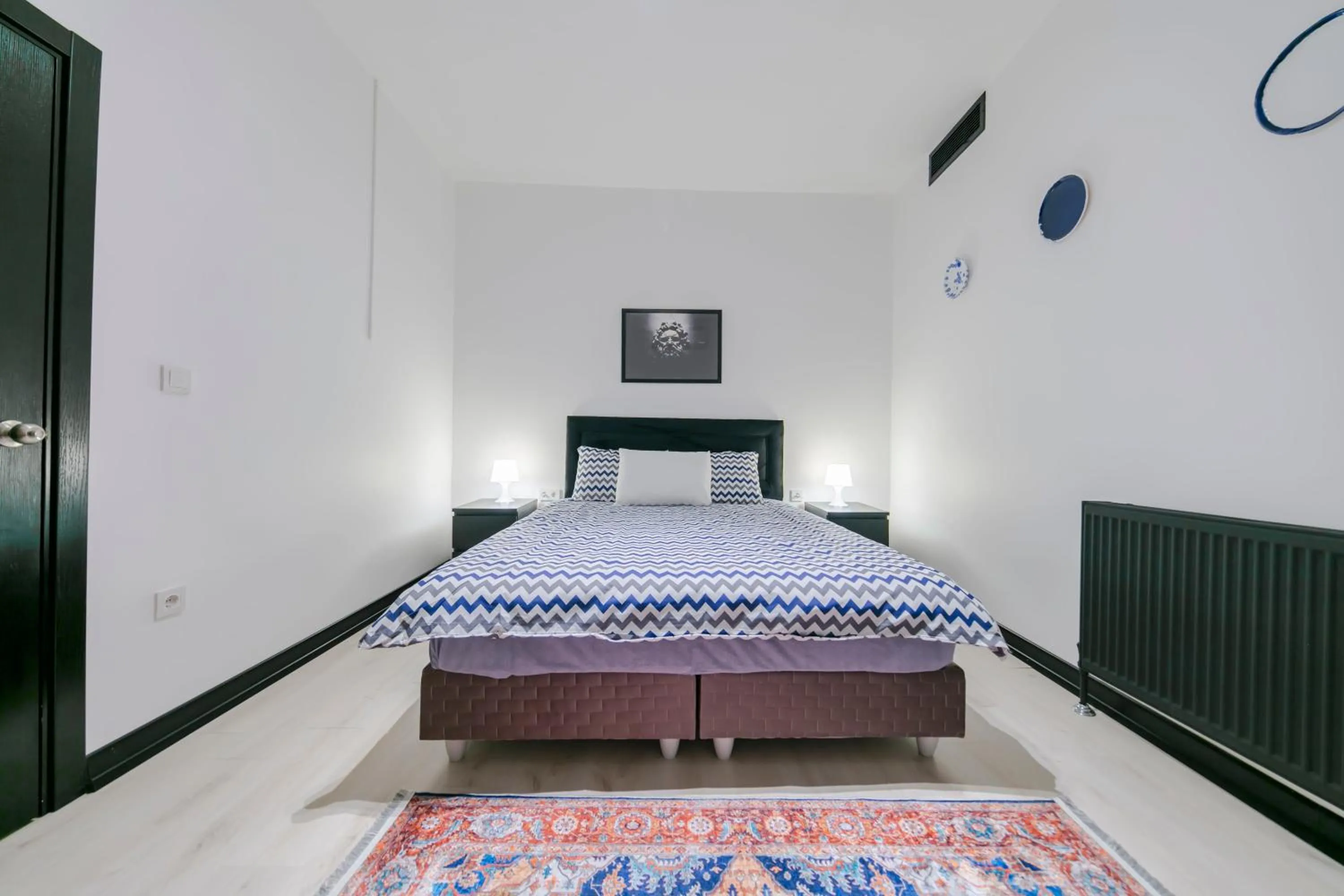 Bed in Hexa Suites Hotel