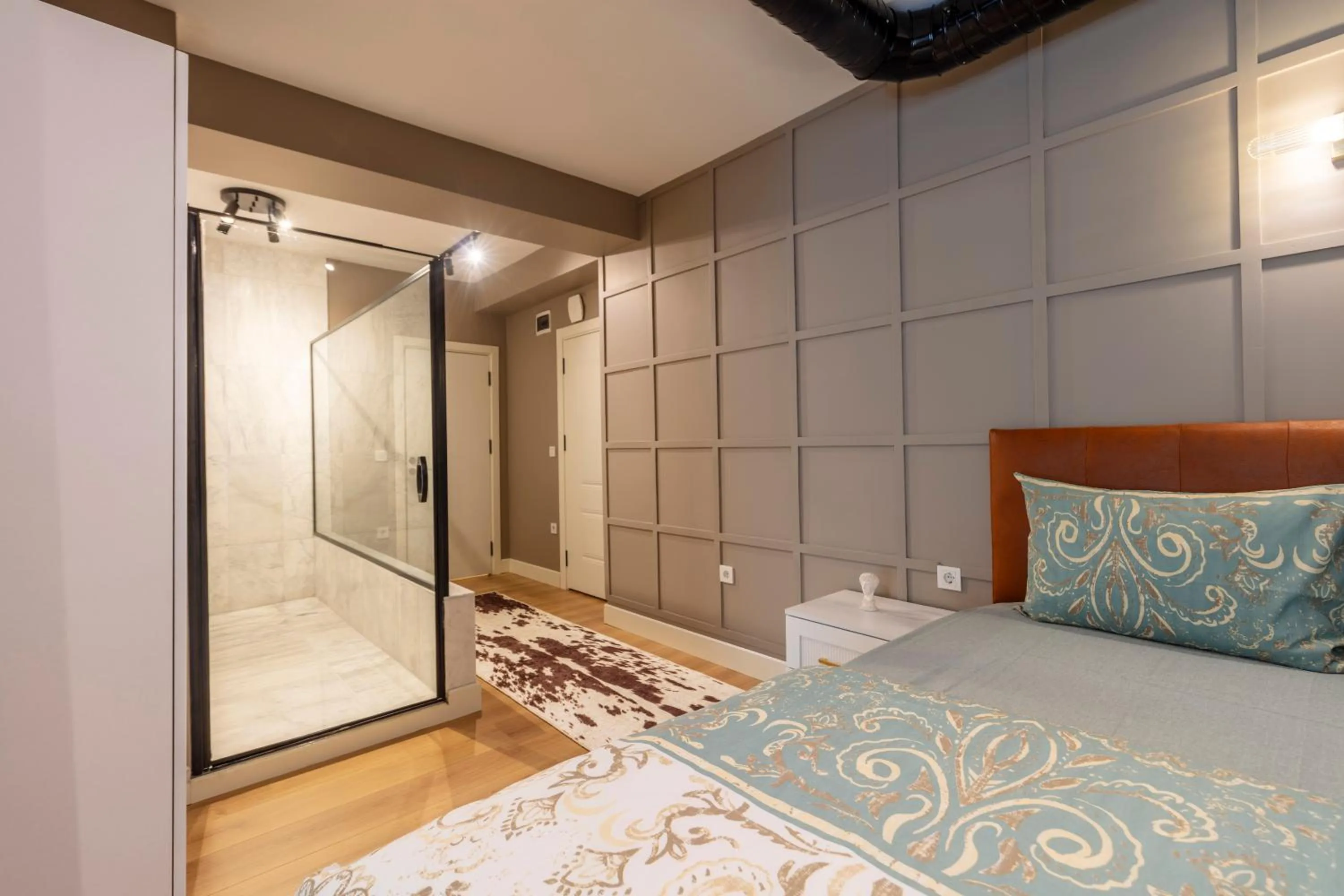 Bed in Hexa Suites Hotel