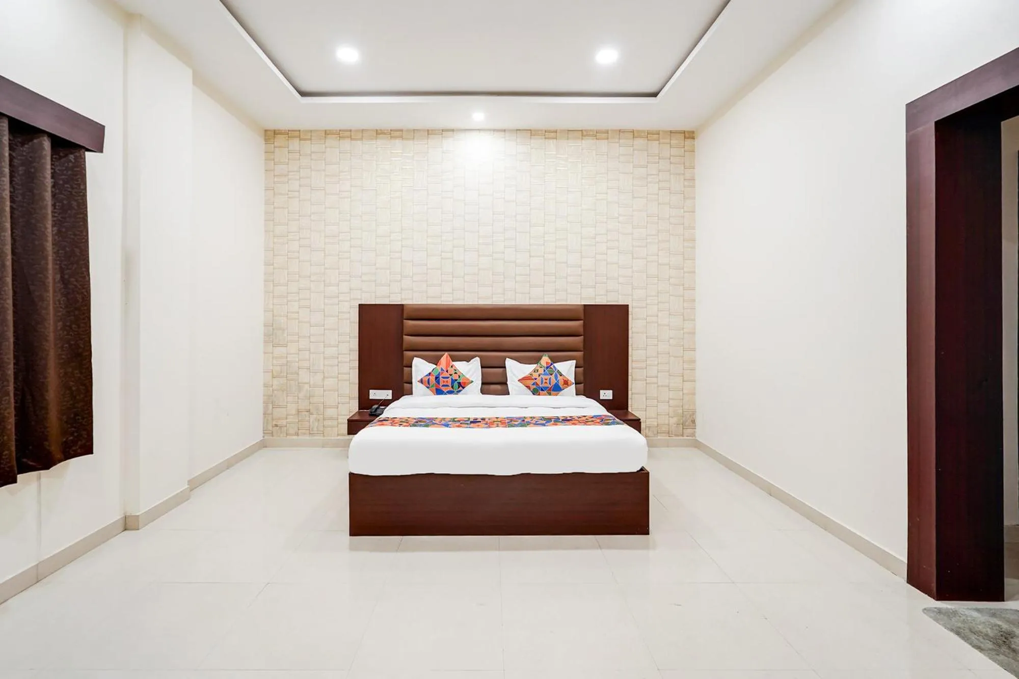 Bed in FabHotel Palm Bliss