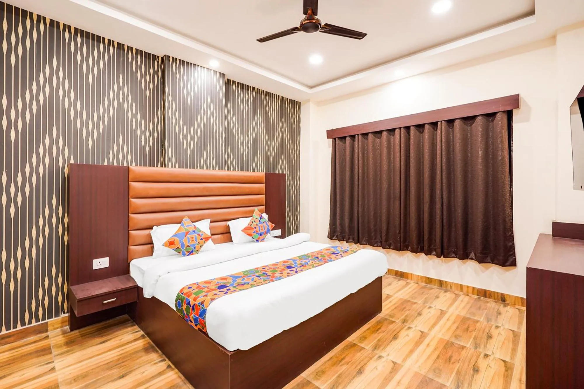 Bed in FabHotel Palm Bliss